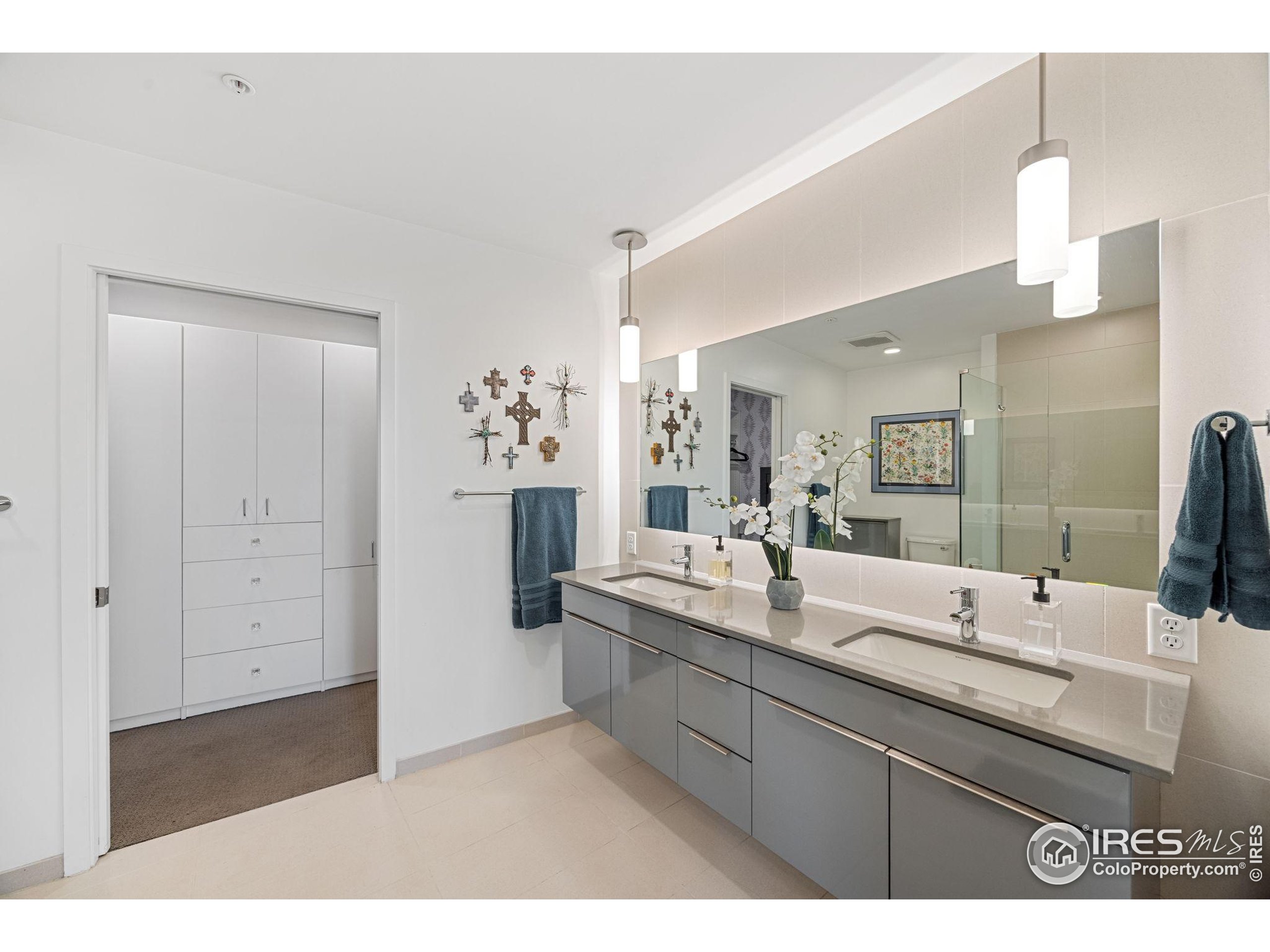 401 Linden Street, Unit 307 Fort Collins, CO 80524 - Photo 17 of 47 a bathroom with a sink and mirror