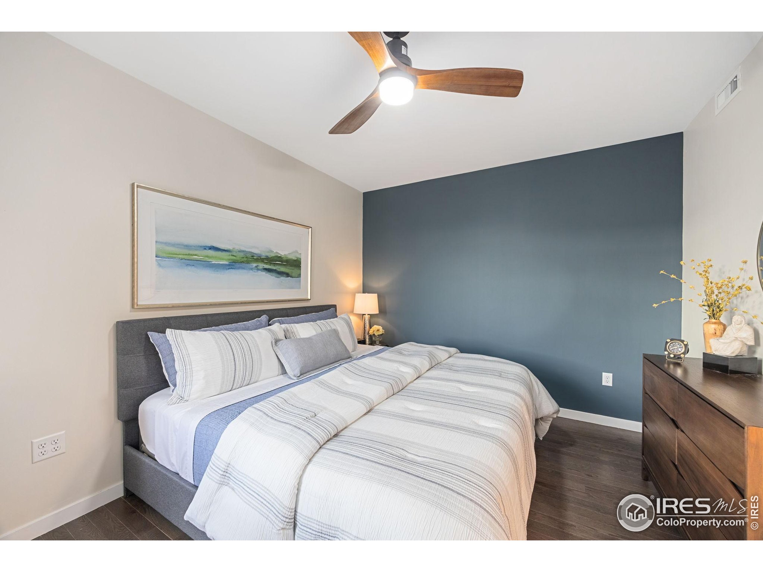 401 Linden Street, Unit 307 Fort Collins, CO 80524 - Photo 21 of 47 a bedroom with a bed and a painting on the wall