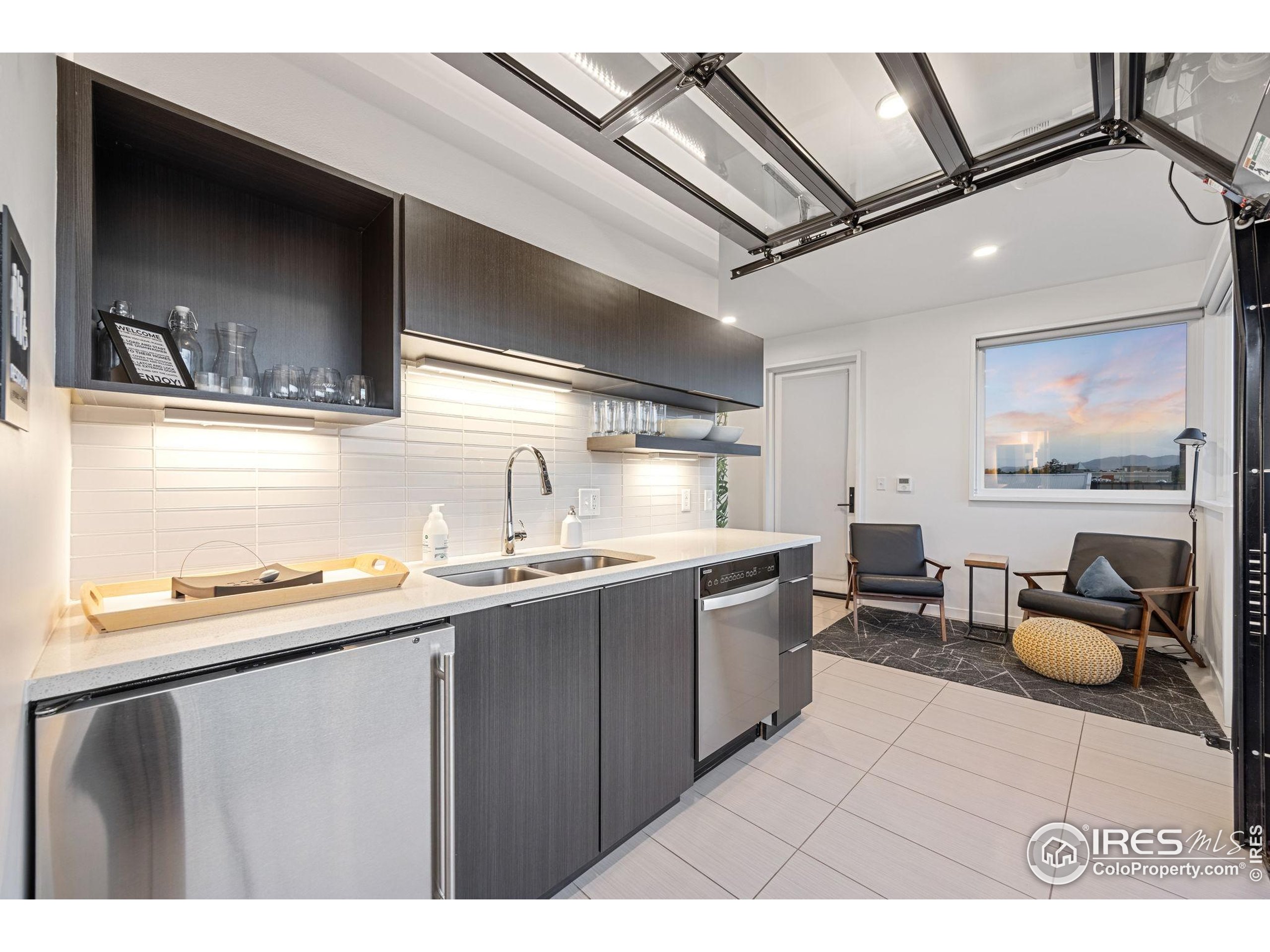 401 Linden Street, Unit 307 Fort Collins, CO 80524 - Photo 32 of 47 a kitchen with a sink and cabinets