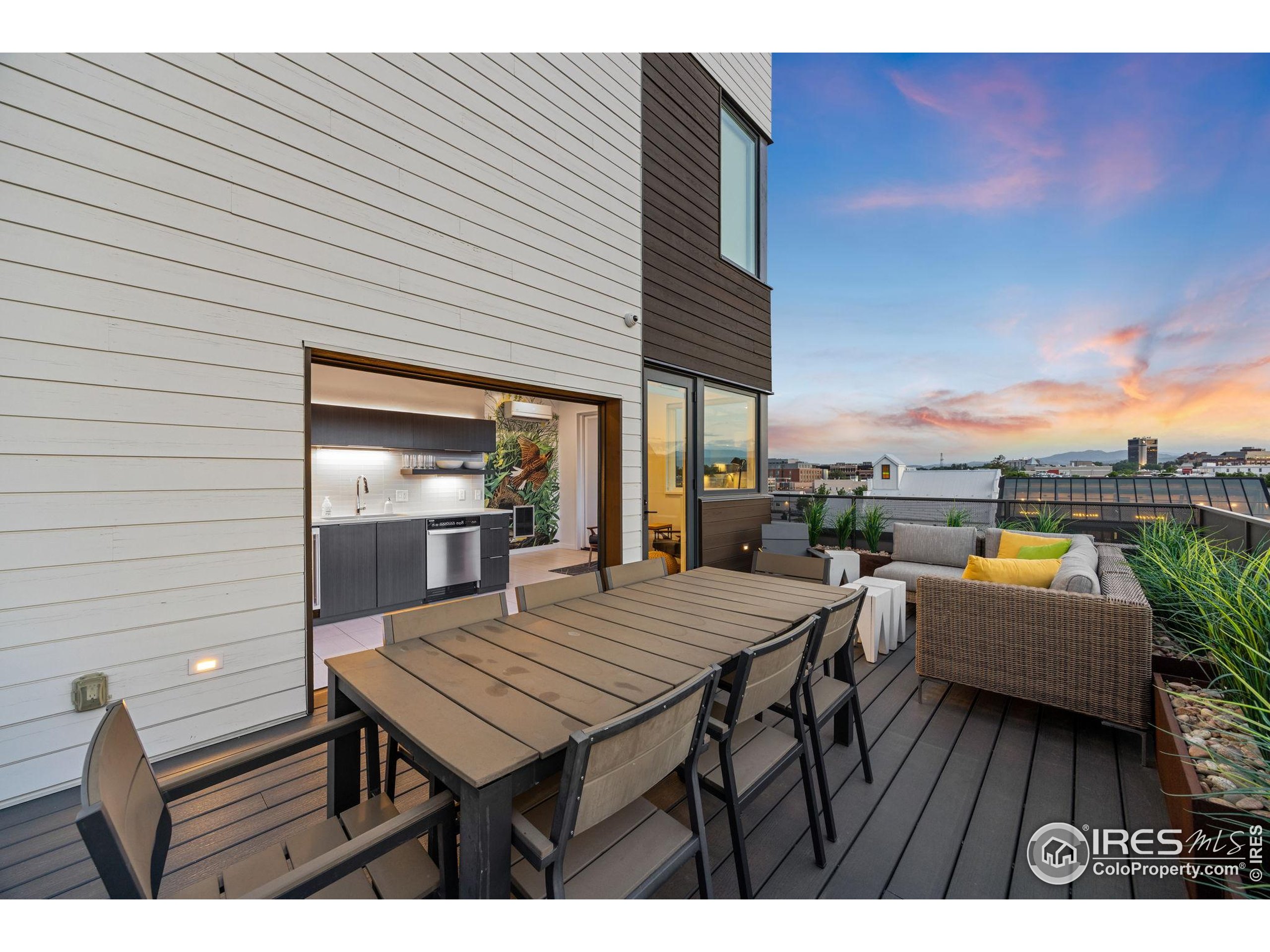 401 Linden Street, Unit 307 Fort Collins, CO 80524 - Photo 33 of 47 a view of a patio with table and chairs