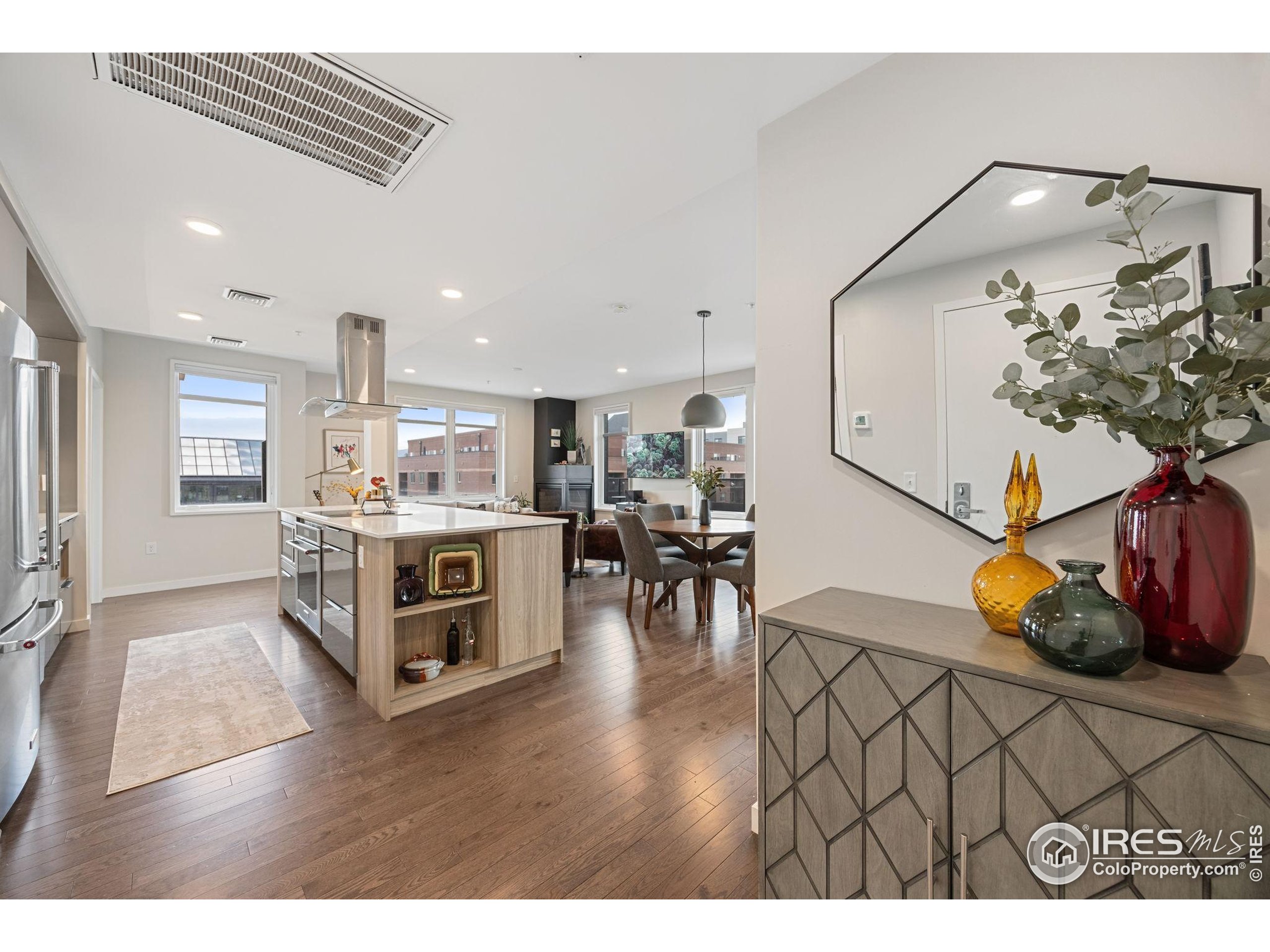 401 Linden Street, Unit 307 Fort Collins, CO 80524 - Photo 4 of 47 a living room with furniture and wooden floor