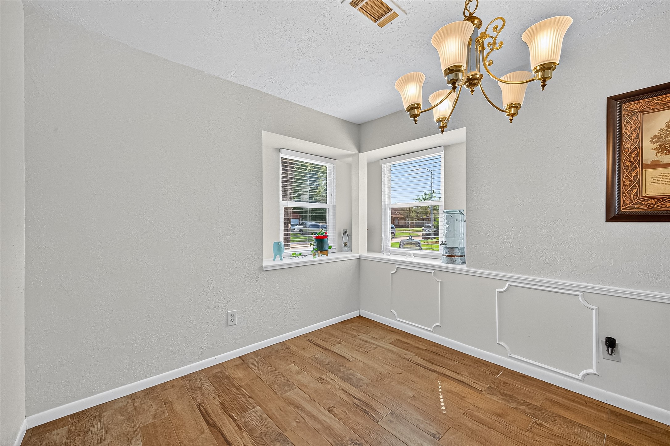 14415 Wadebridge Way Houston, TX 77015 - Photo 14 of 41 a view of empty room with wooden floor and fan