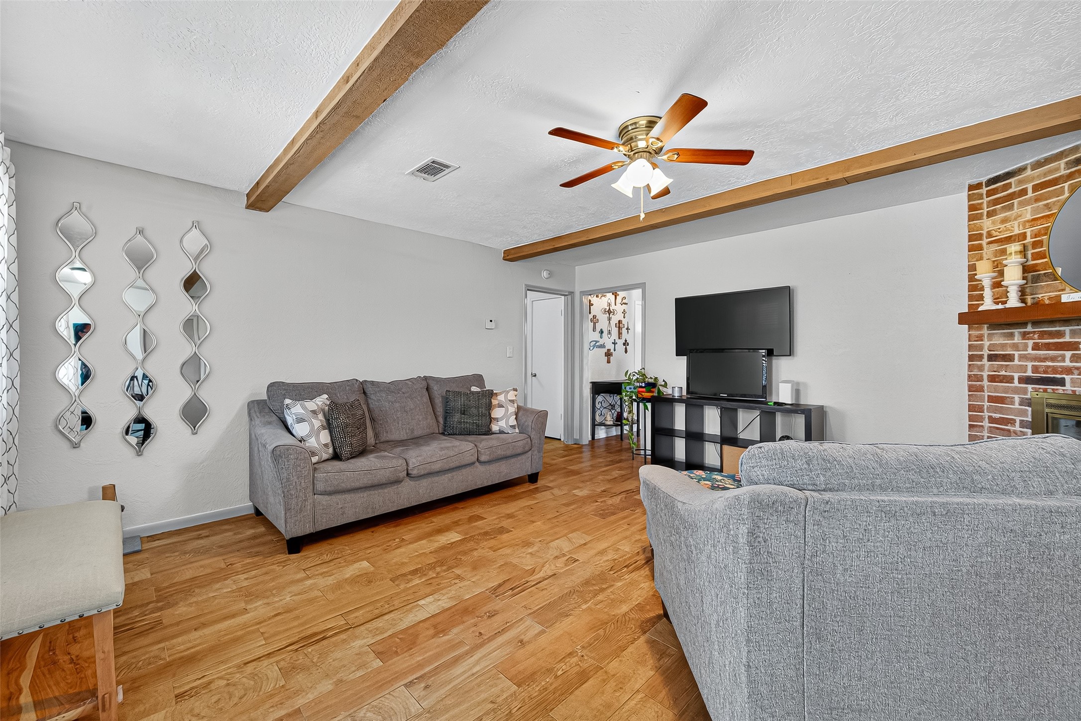 14415 Wadebridge Way Houston, TX 77015 - Photo 15 of 41 a living room with furniture and a flat screen tv