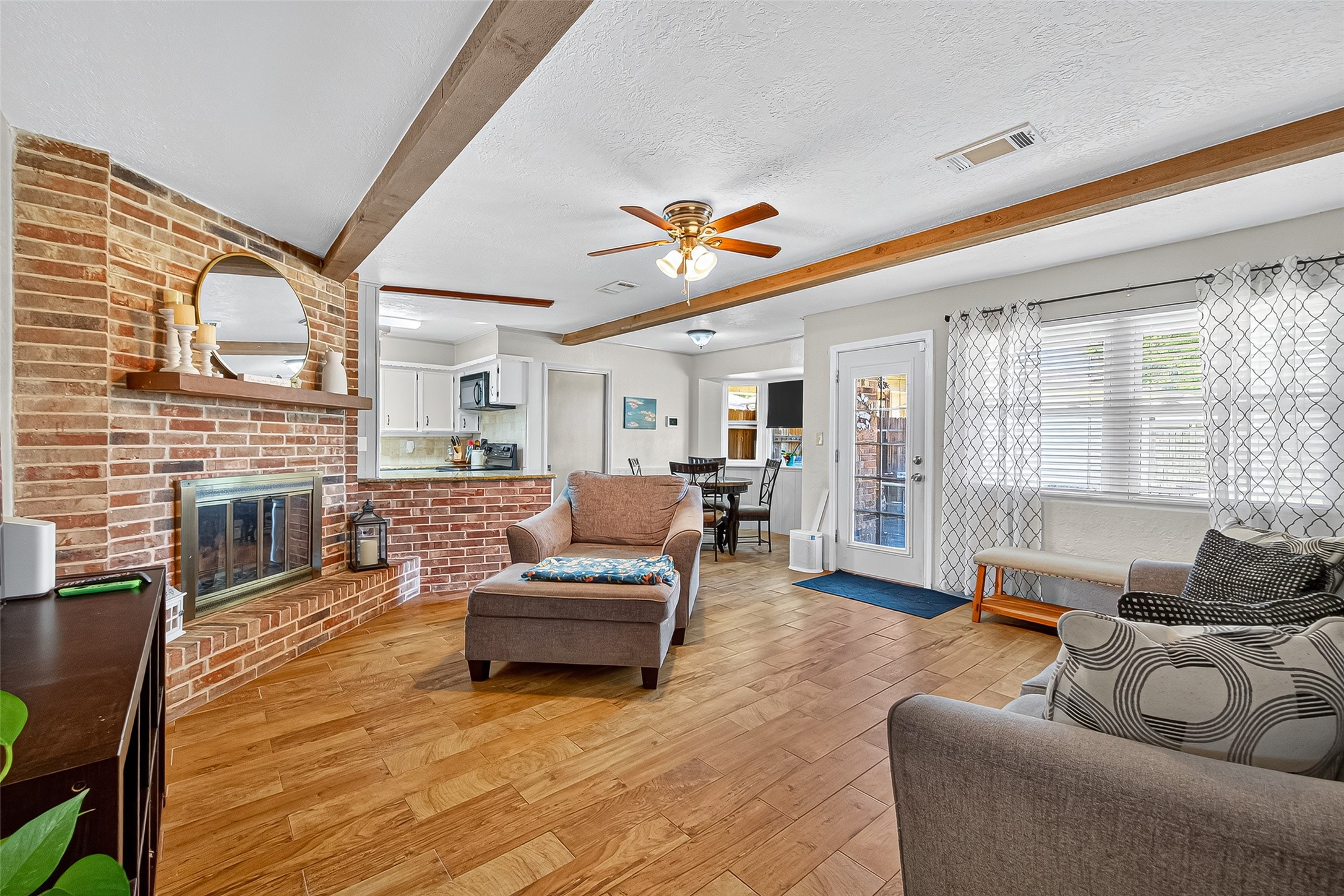 14415 Wadebridge Way Houston, TX 77015 - Photo 17 of 41 a living room with furniture and a fireplace