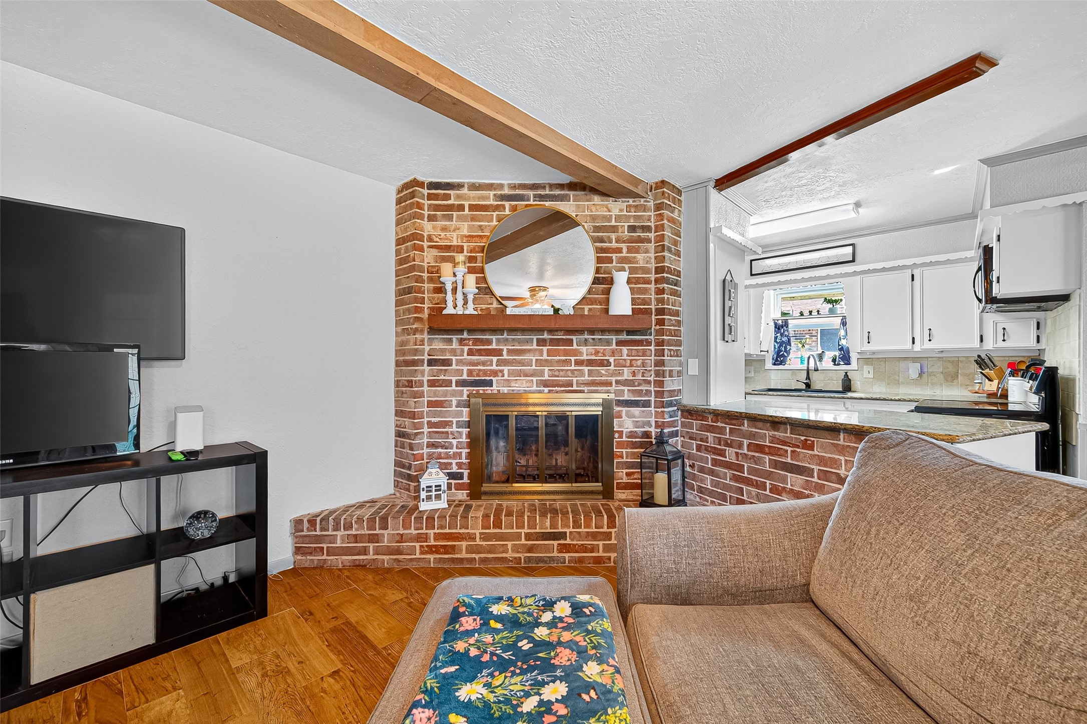 14415 Wadebridge Way Houston, TX 77015 - Photo 18 of 41 a living room with furniture or couch and a fireplace