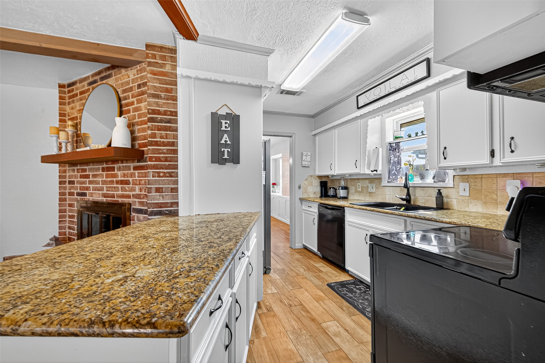 14415 Wadebridge Way Houston, TX 77015 - Photo 21 of 41 a kitchen with stainless steel appliances granite countertop a stove refrigerator sink and cabinets