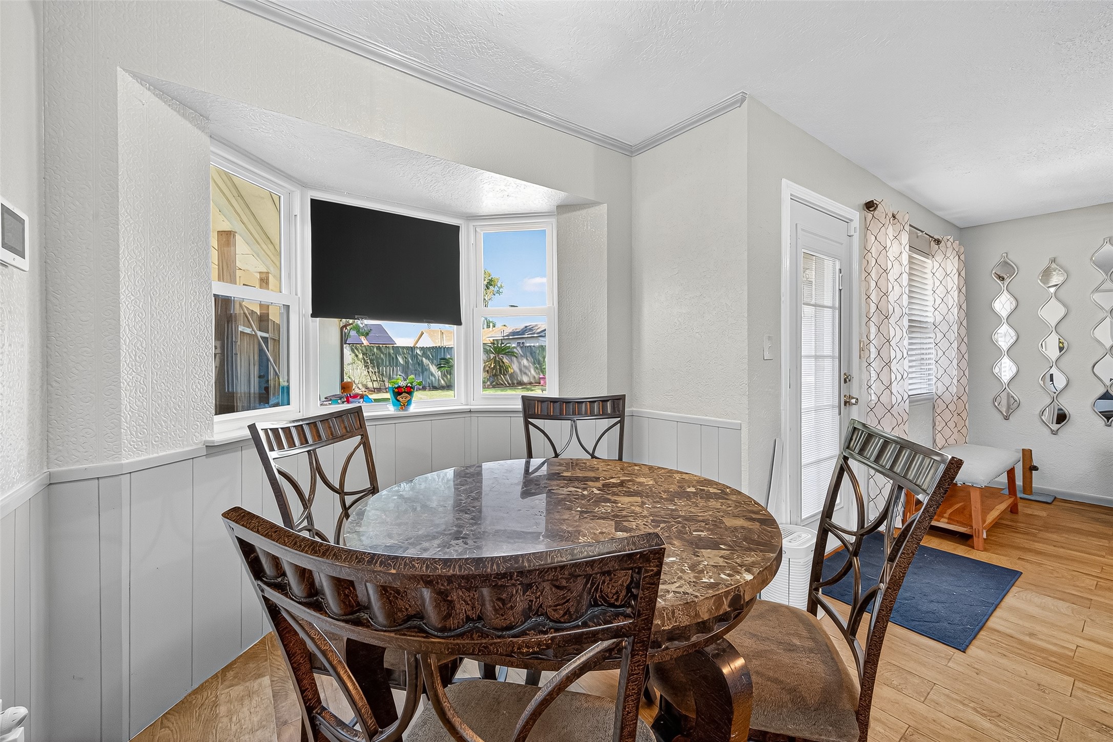 14415 Wadebridge Way Houston, TX 77015 - Photo 22 of 41 a view of a dining room with furniture window and wooden floor