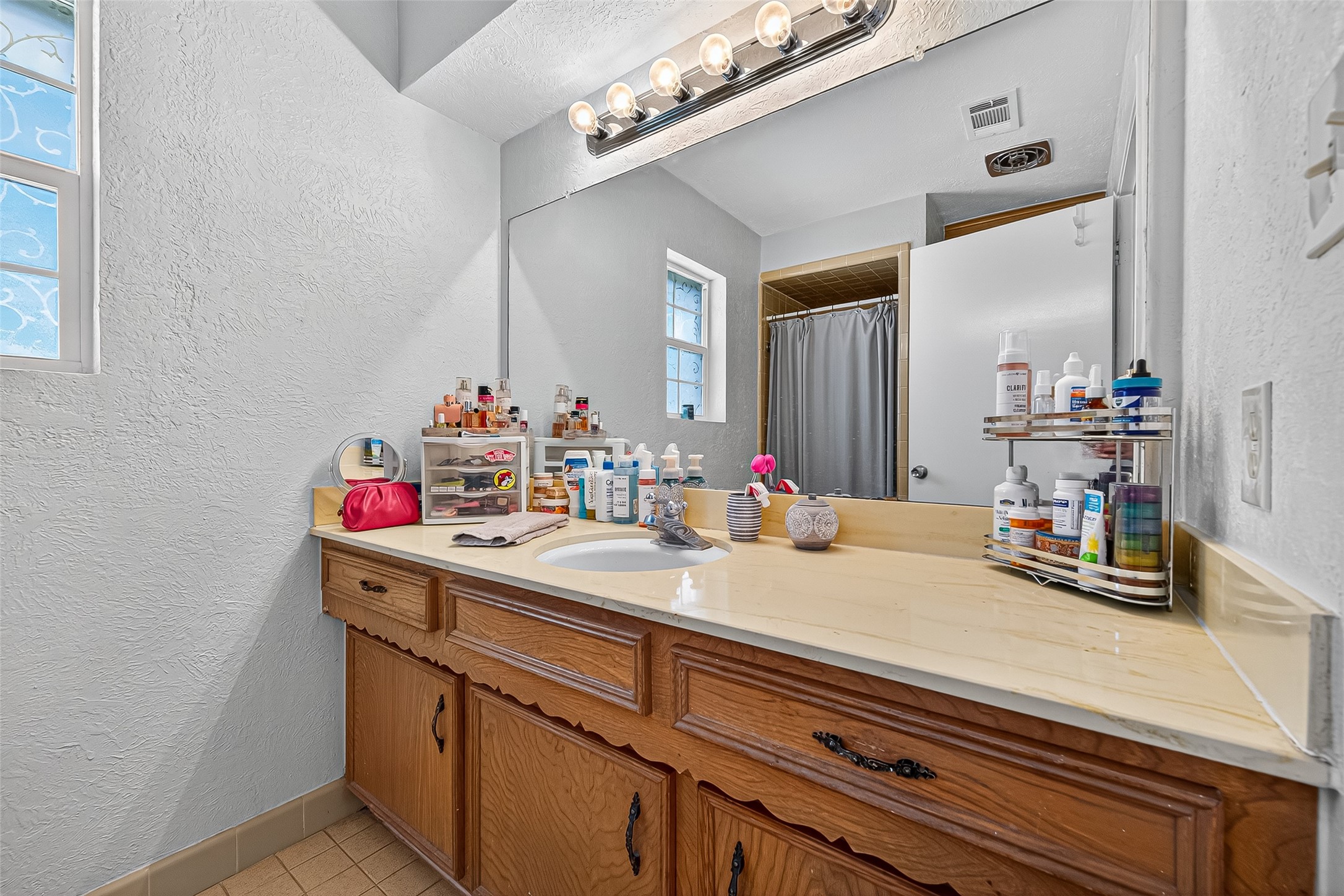 14415 Wadebridge Way Houston, TX 77015 - Photo 26 of 41 a bathroom with a sink and a mirror