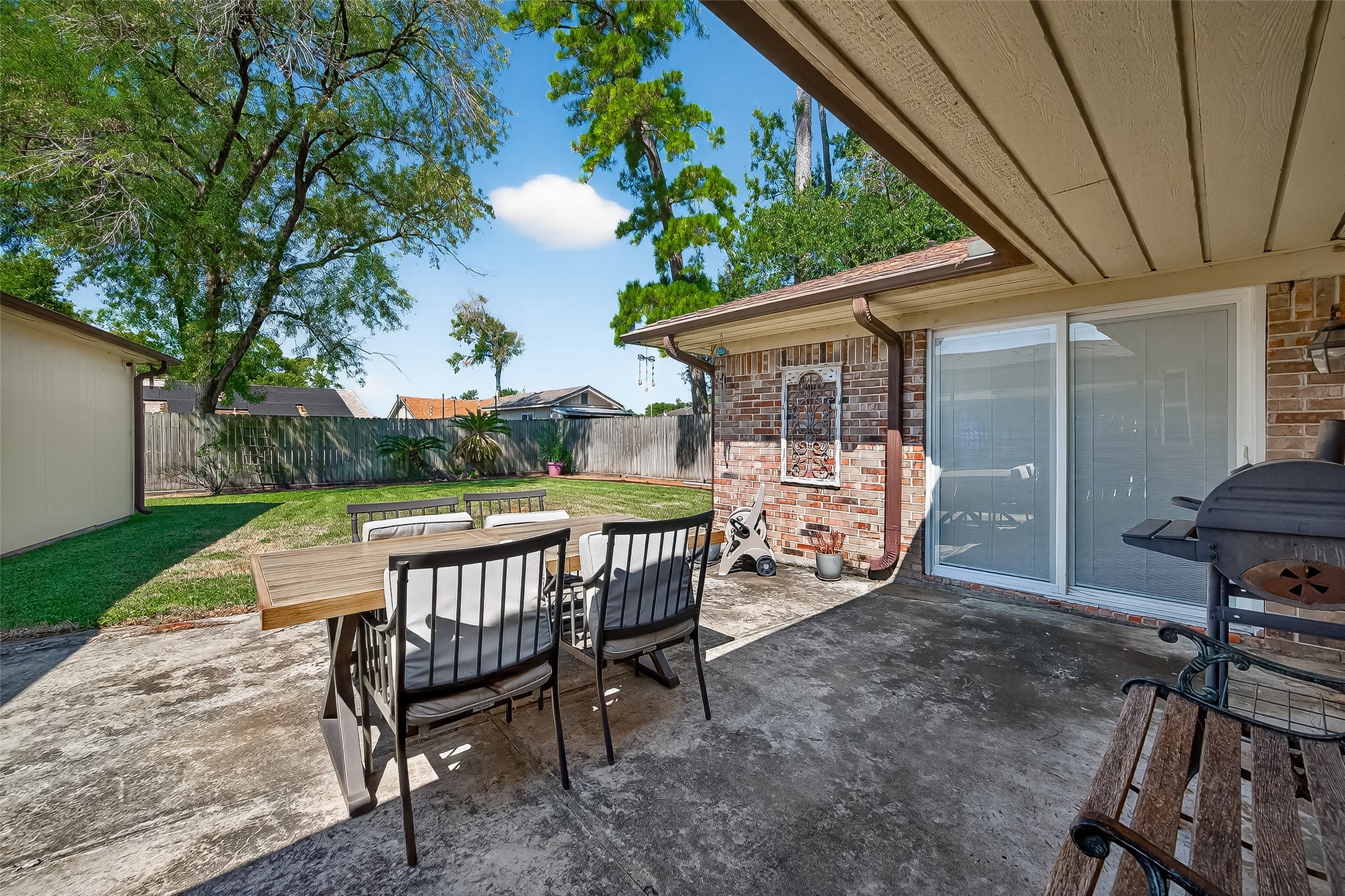 14415 Wadebridge Way Houston, TX 77015 - Photo 36 of 41 a view of a patio with table and chairs with wooden floor and fence