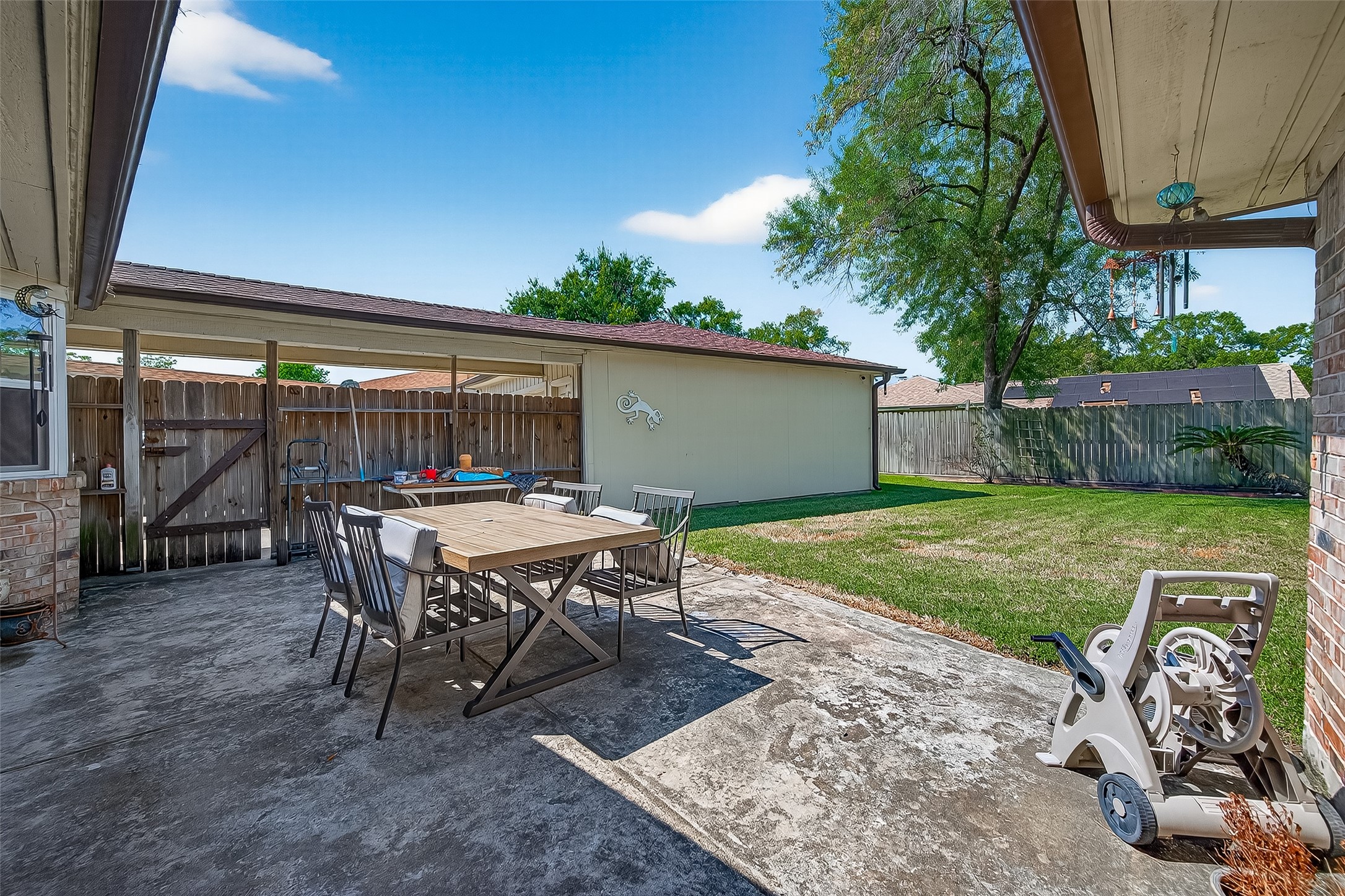 14415 Wadebridge Way Houston, TX 77015 - Photo 37 of 41 a backyard of a house with table and chairs