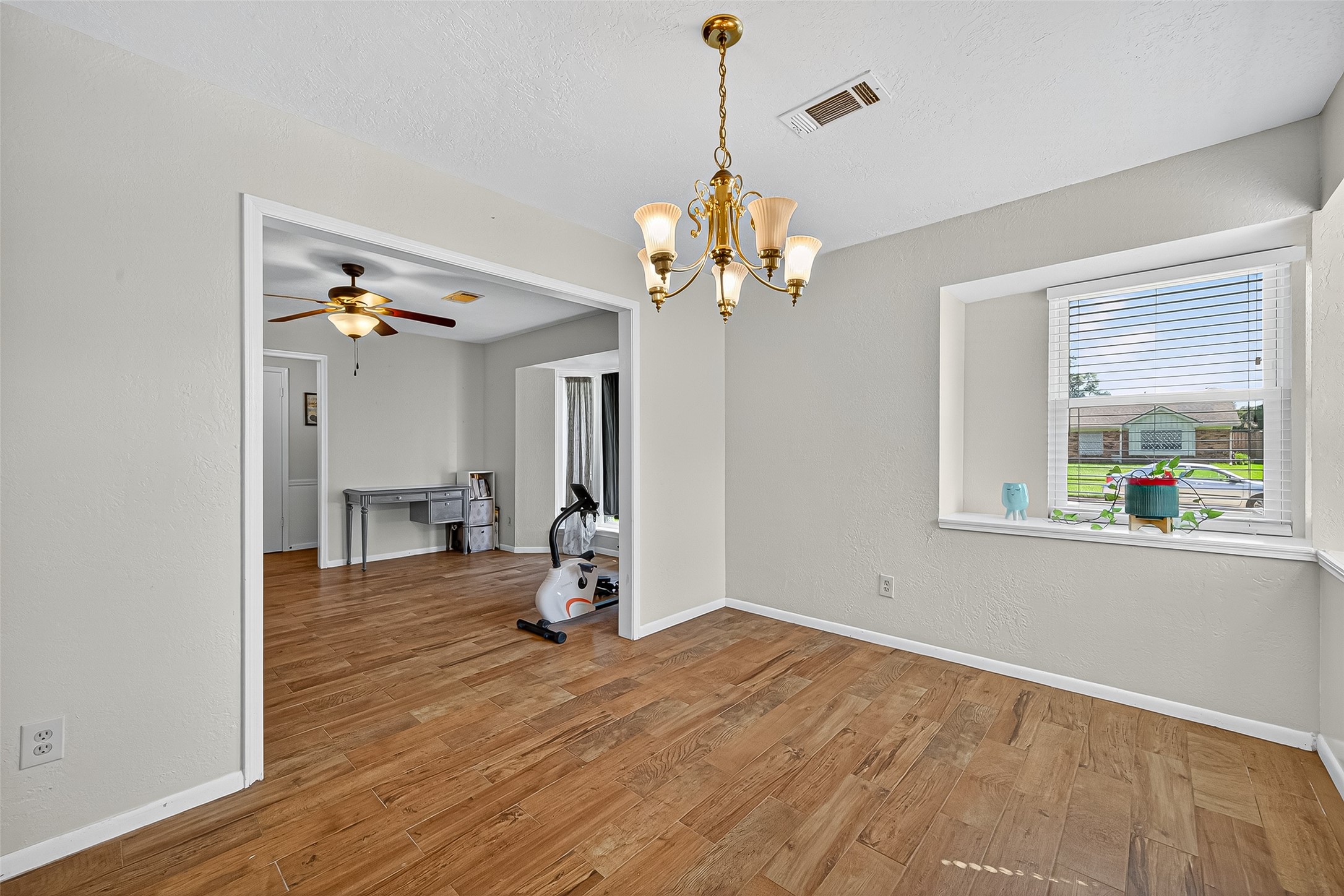 14415 Wadebridge Way Houston, TX 77015 - Photo 9 of 41 a view of a dining room with a table and chairs