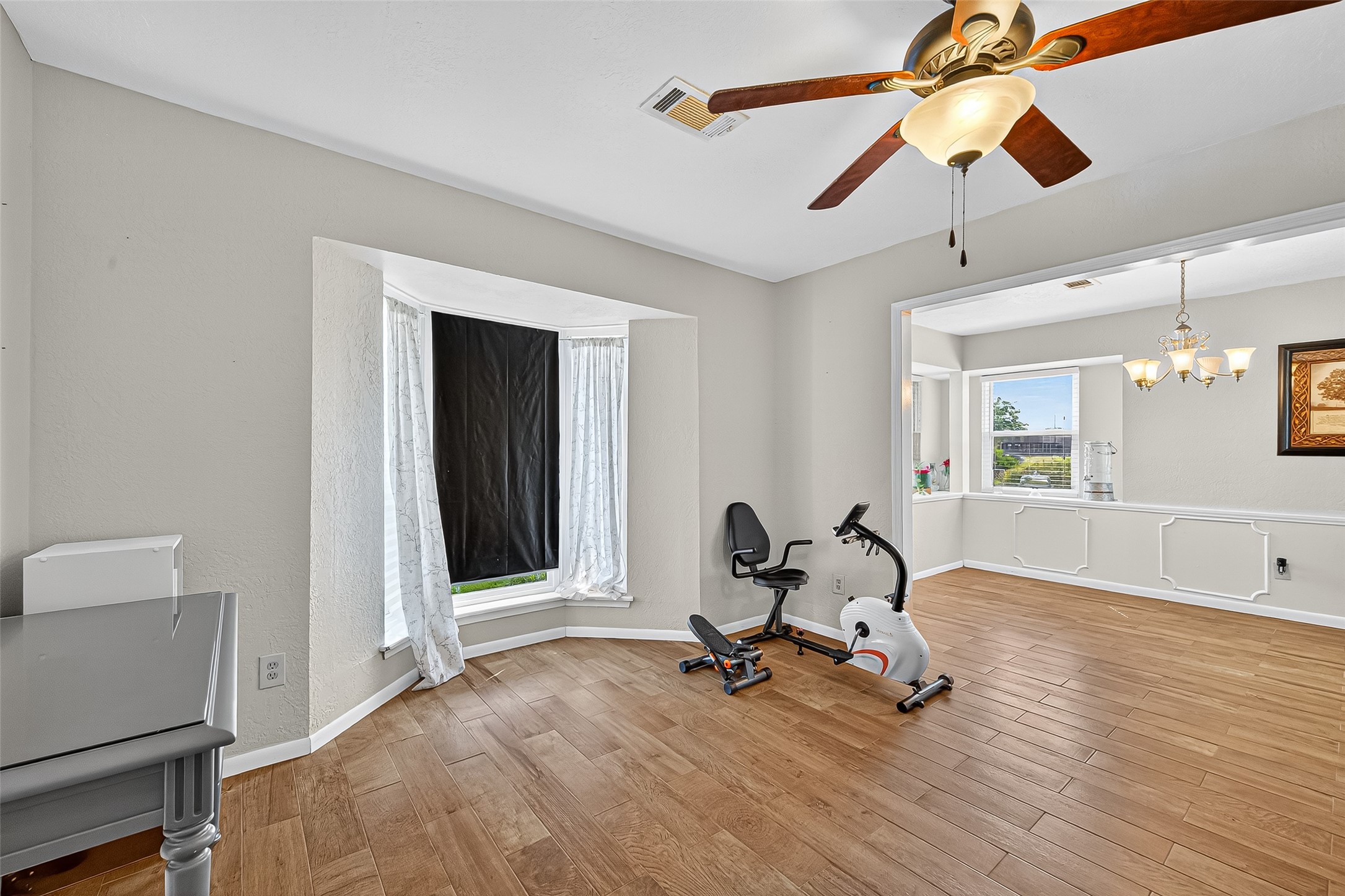 14415 Wadebridge Way Houston, TX 77015 - Photo 10 of 41 a view of a room with gym equipment and a window