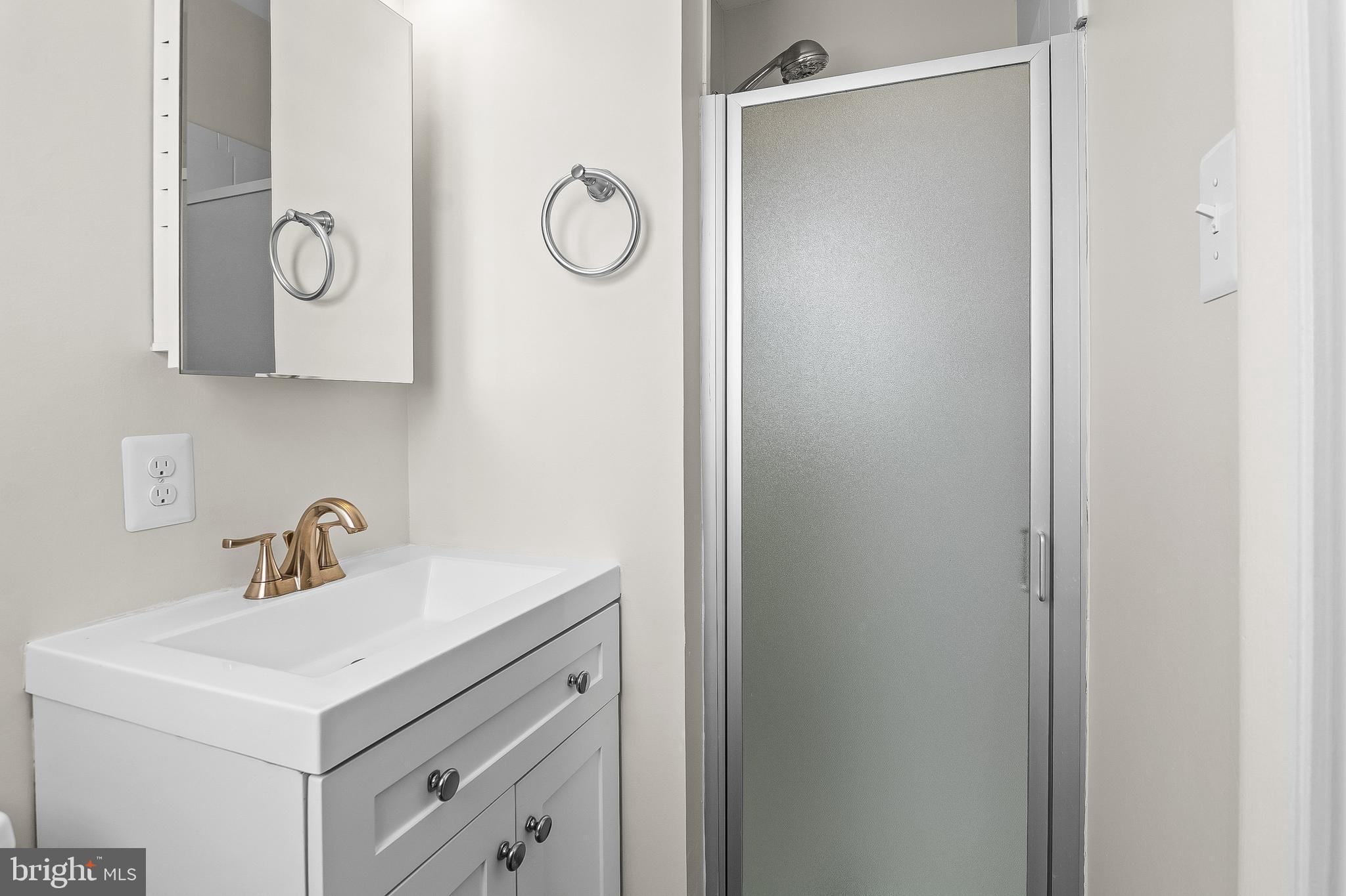 13 Moray Court Baltimore, MD 21236 - Photo 23 of 55 a bathroom with a sink and a mirror
