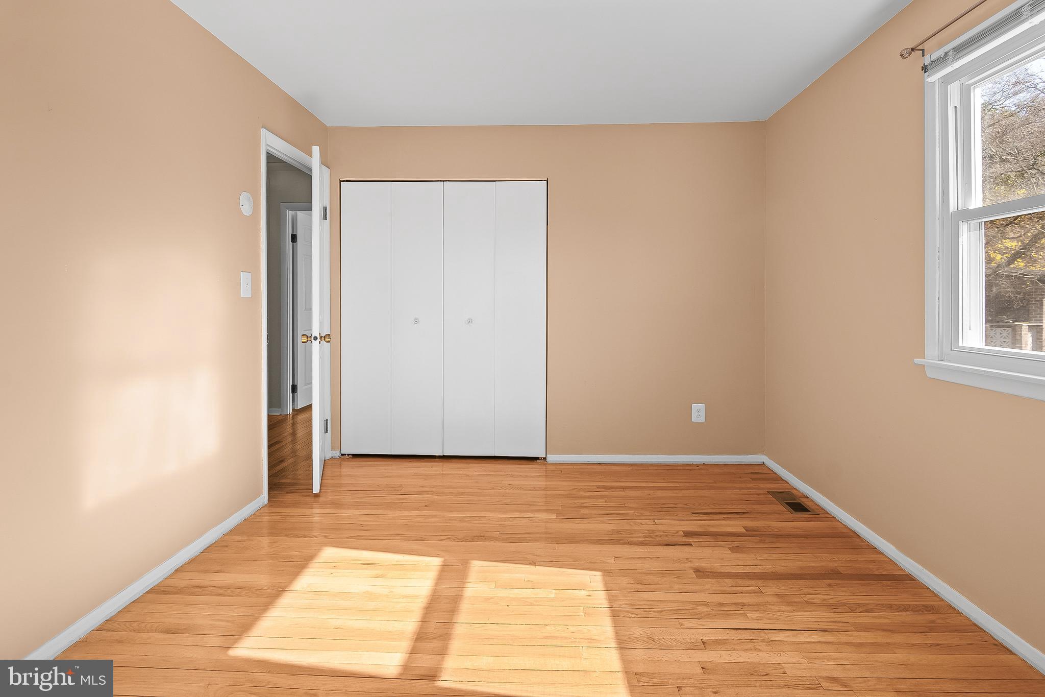 13 Moray Court Baltimore, MD 21236 - Photo 26 of 55 a view of a room with wooden floor and a window