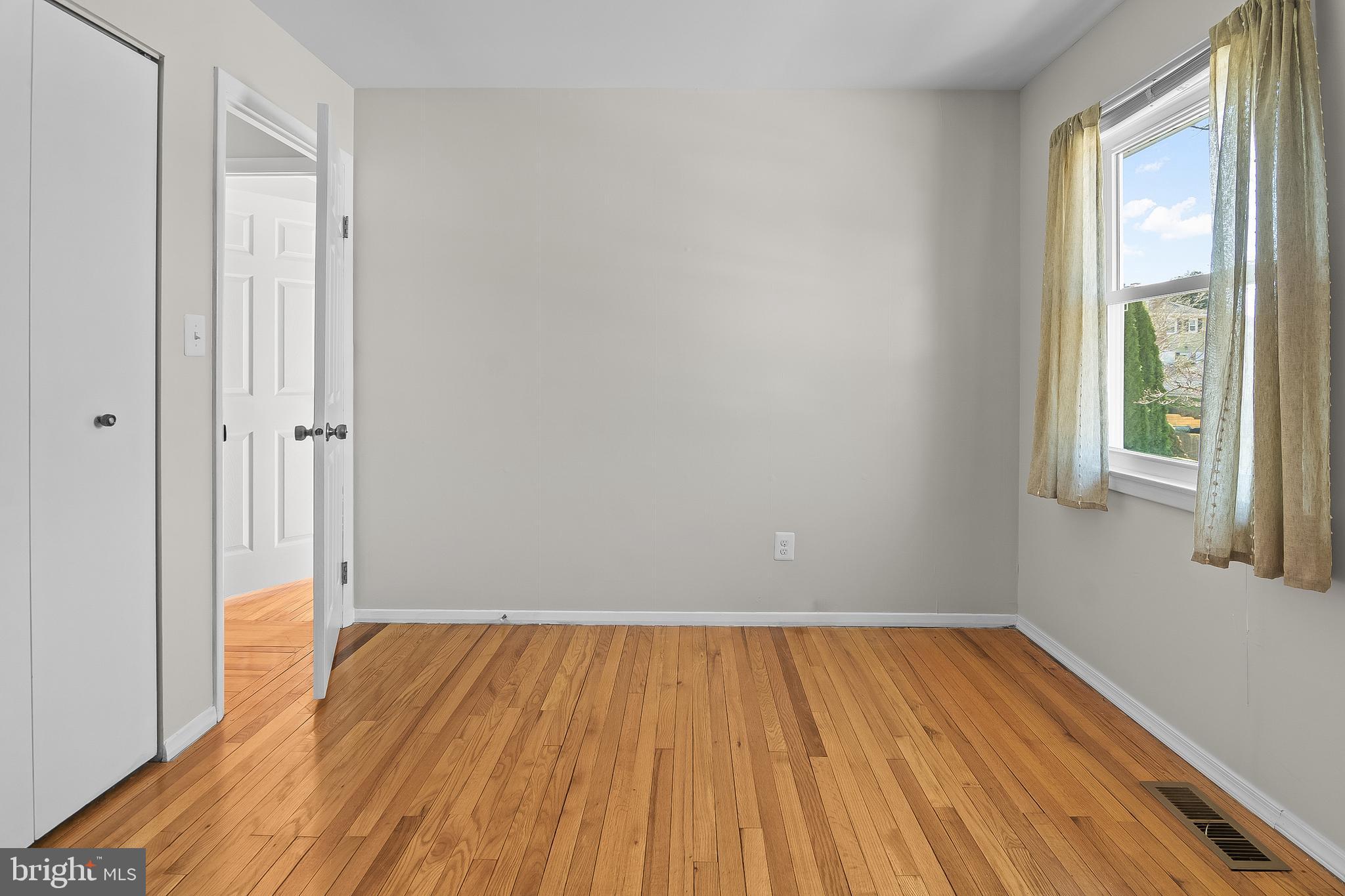 13 Moray Court Baltimore, MD 21236 - Photo 28 of 55 a view of a room with wooden floor and windows