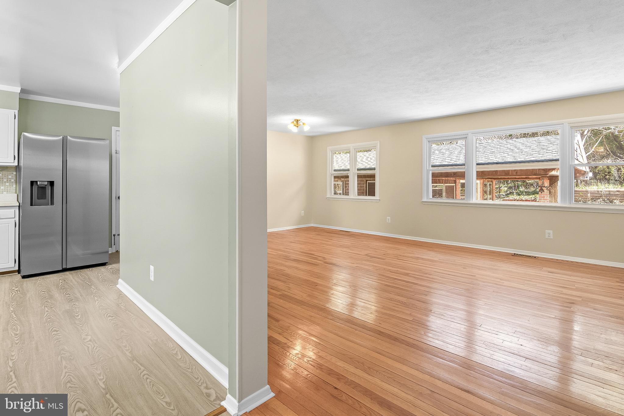 13 Moray Court Baltimore, MD 21236 - Photo 55 of 55 a view of an empty room with wooden floor and a window