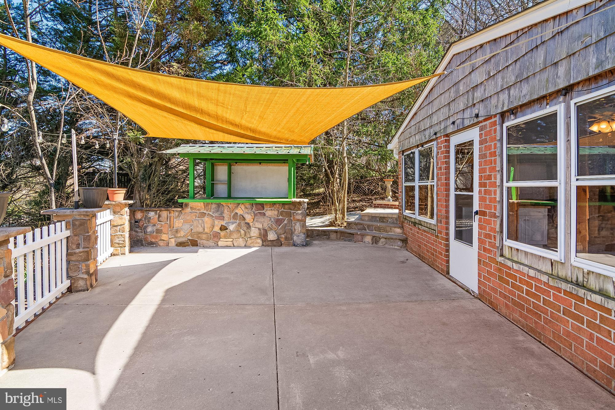 13 Moray Court Baltimore, MD 21236 - Photo 43 of 55 a view of a patio with a table and chairs