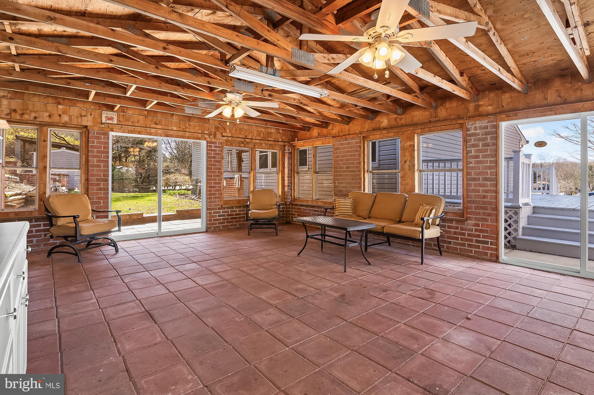 13 Moray Court Baltimore, MD 21236 - Photo 49 of 55 a building outdoor space with patio furniture and a couch