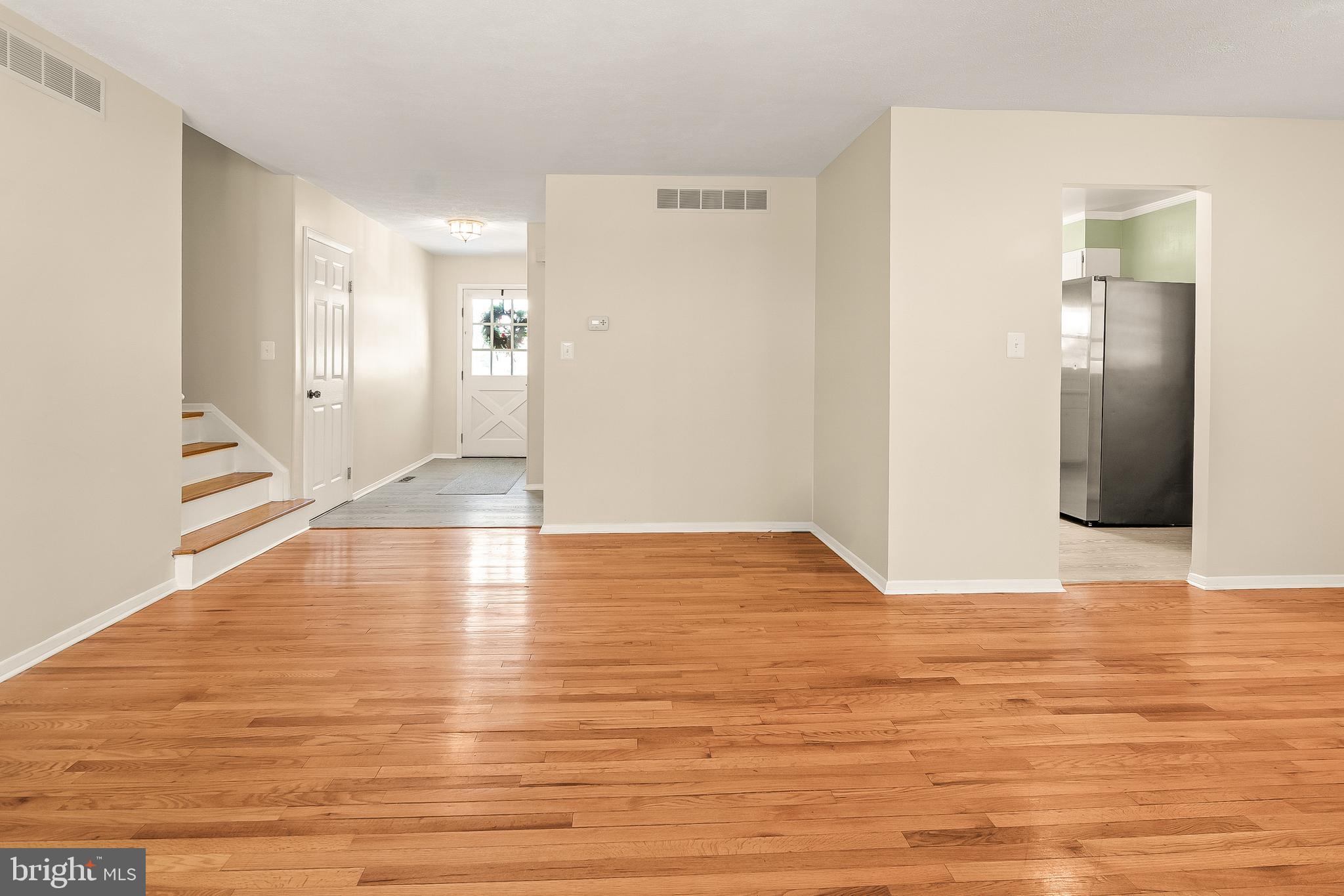 13 Moray Court Baltimore, MD 21236 - Photo 6 of 55 a view of empty room with wooden floor
