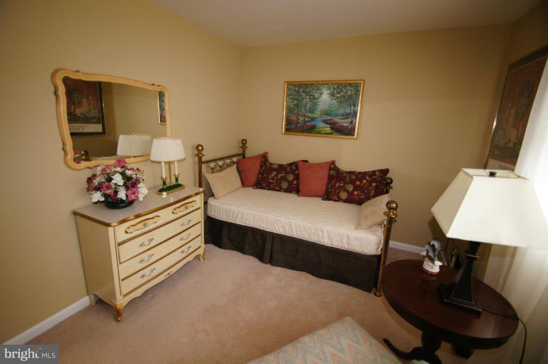 9504 Dundawan Road Nottingham, MD 21236 - Photo 16 of 30 a bed room with a bed and a couch