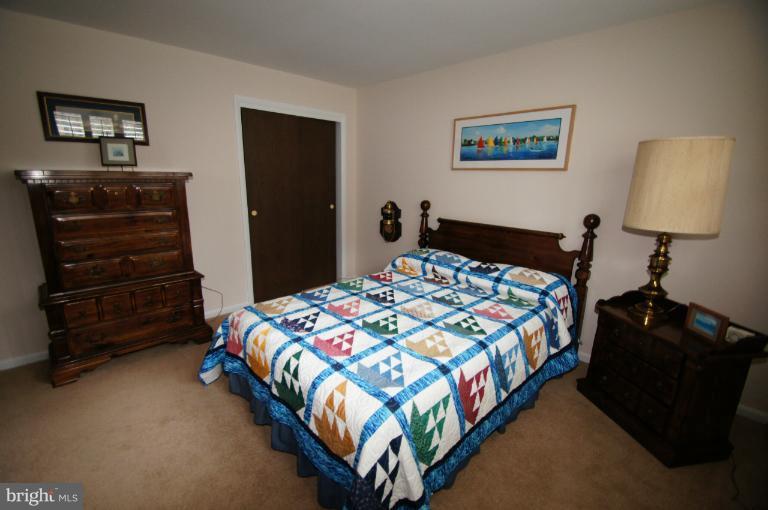 9504 Dundawan Road Nottingham, MD 21236 - Photo 20 of 30 a bedroom with a bed and a dresser