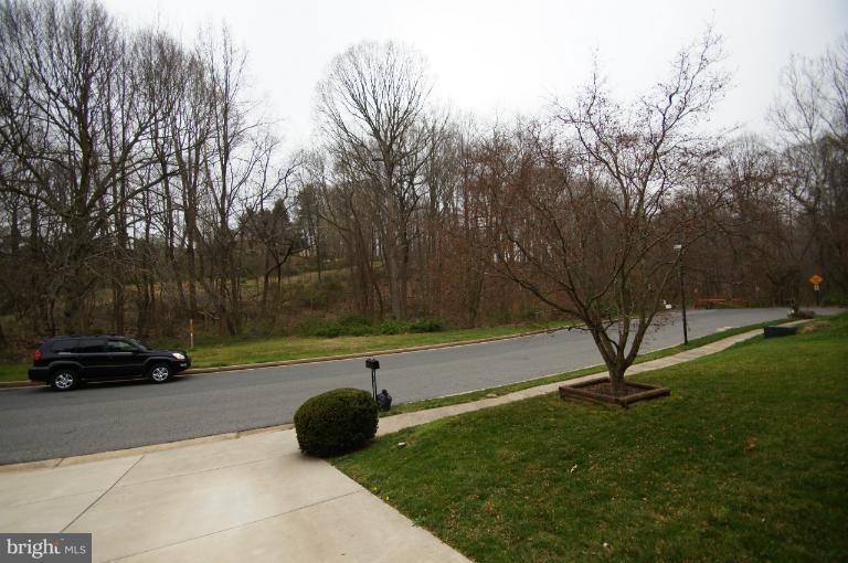 9504 Dundawan Road Nottingham, MD 21236 - Photo 5 of 30 a view of a park with bench and trees