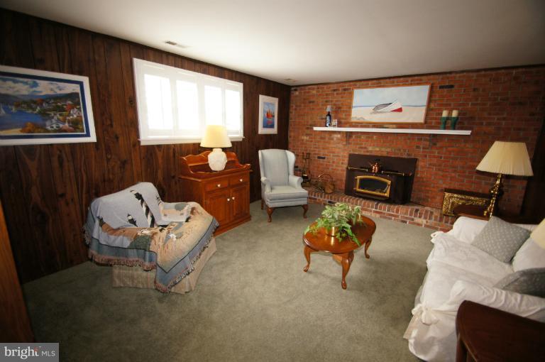 9504 Dundawan Road Nottingham, MD 21236 - Photo 7 of 30 a living room with furniture and a fireplace