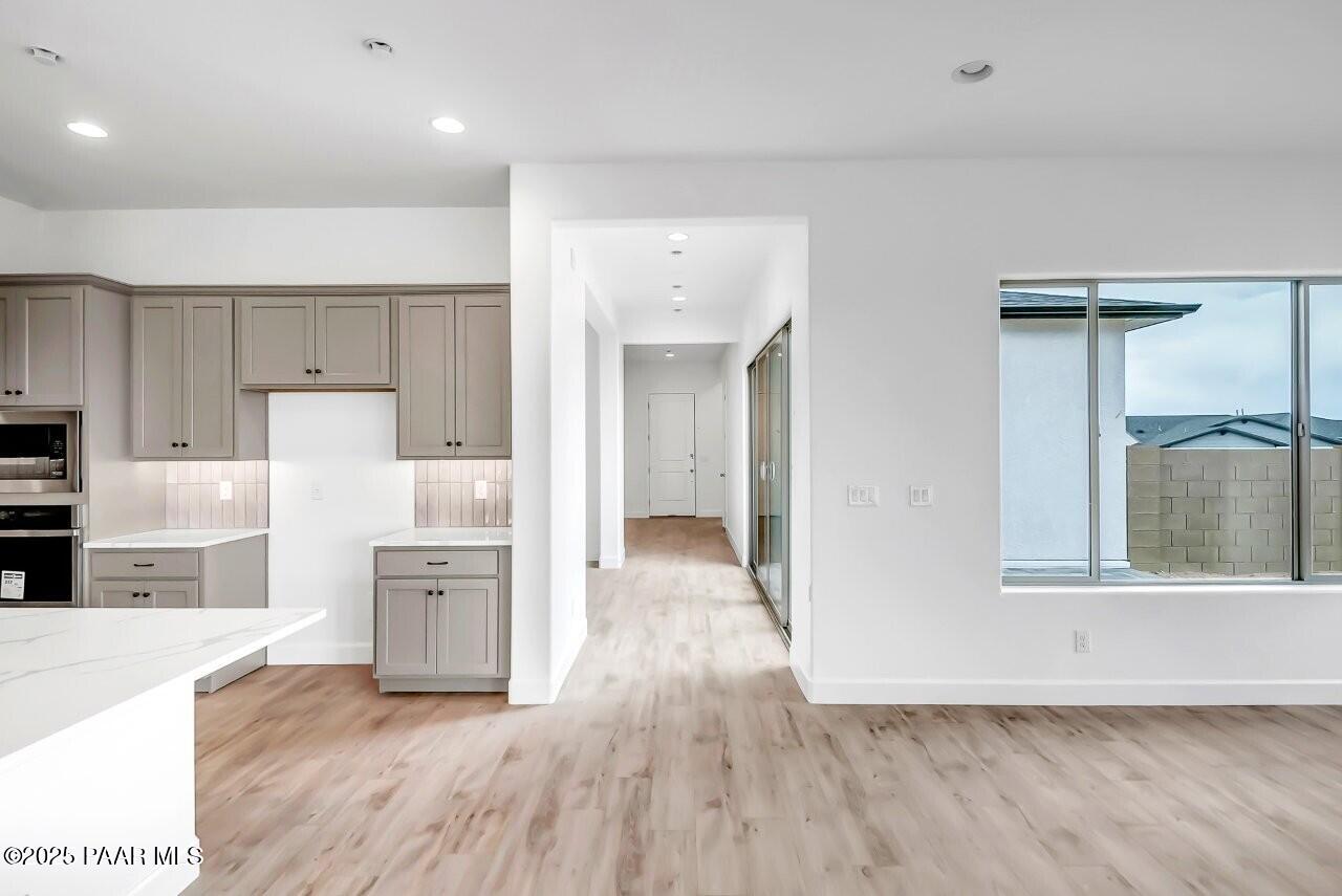 5229 Iron Vine Trail Prescott, AZ 86301 - Photo 15 of 92 a view of kitchen with furniture and wooden floor