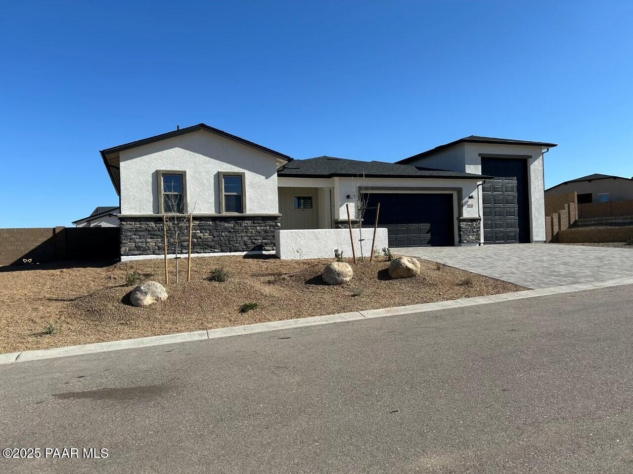 5229 Iron Vine Trail Prescott, AZ 86301 - Photo 2 of 92 a front view of a house with a yard