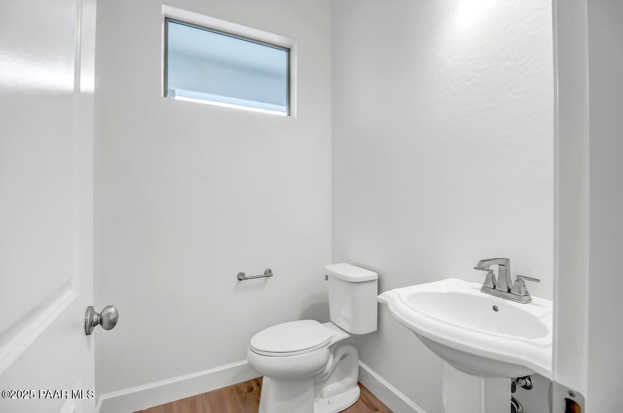5229 Iron Vine Trail Prescott, AZ 86301 - Photo 35 of 92 a bathroom with a sink toilet and a mirror