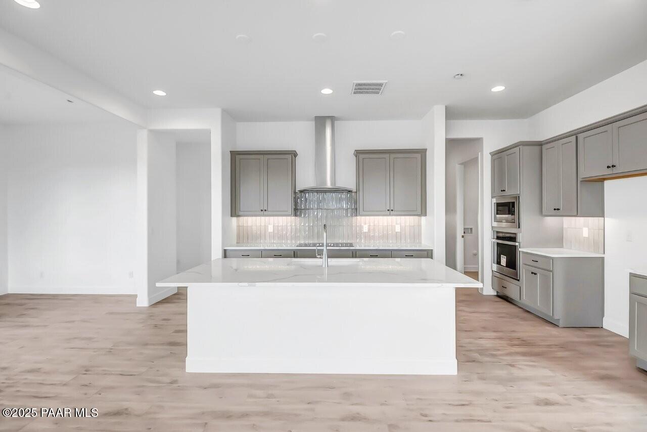 5229 Iron Vine Trail Prescott, AZ 86301 - Photo 5 of 92 a view of kitchen with refrigerator microwave and stove