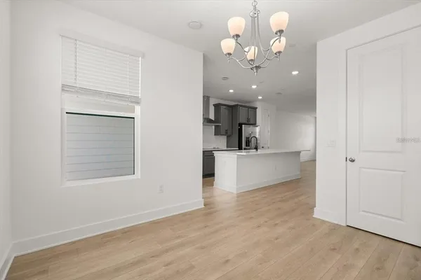 a view of a kitchen with an empty space and a kitchen