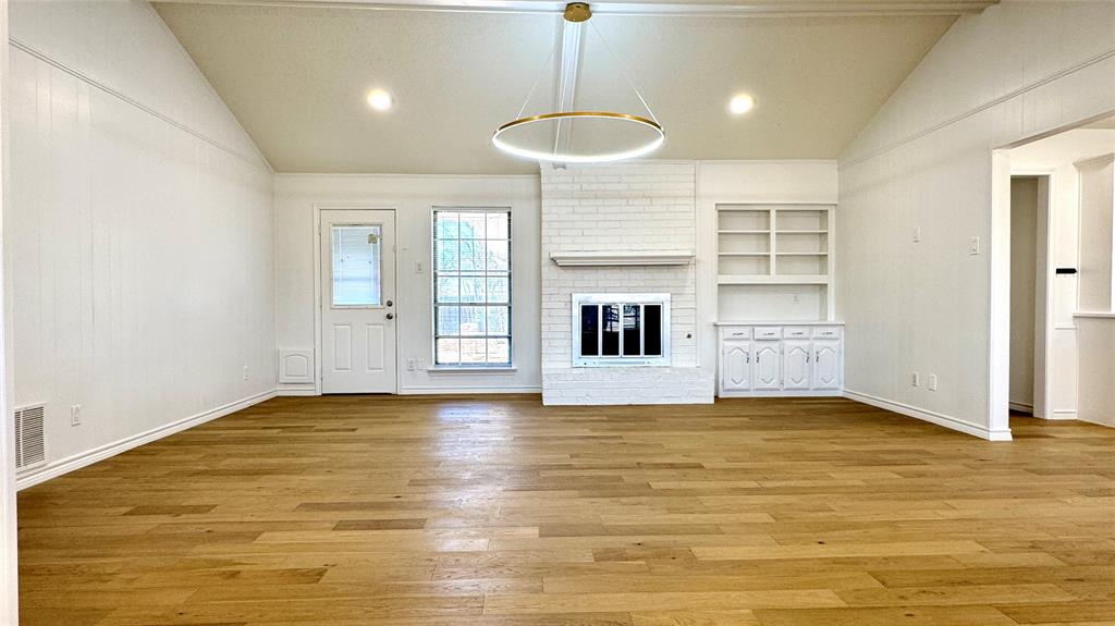 3915 Spring Hollow Drive Carrollton, TX 75007 - Photo 9 of 28 a view of a livingroom with a fireplace