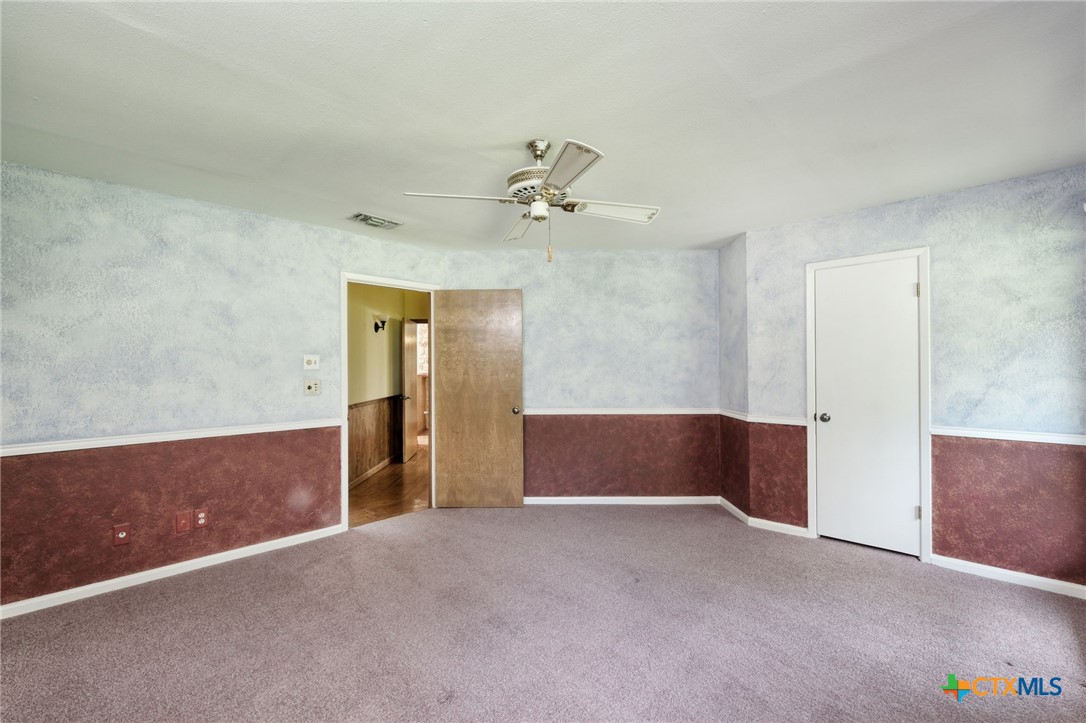 700 Breakaway Road Cedar Park, TX 78613 - Photo 17 of 38 a view of an empty room with a ceiling fan