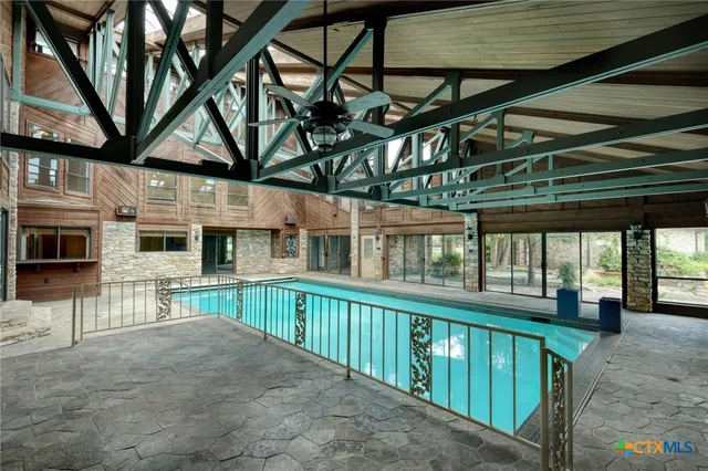 a view of a porch with furniture and garden