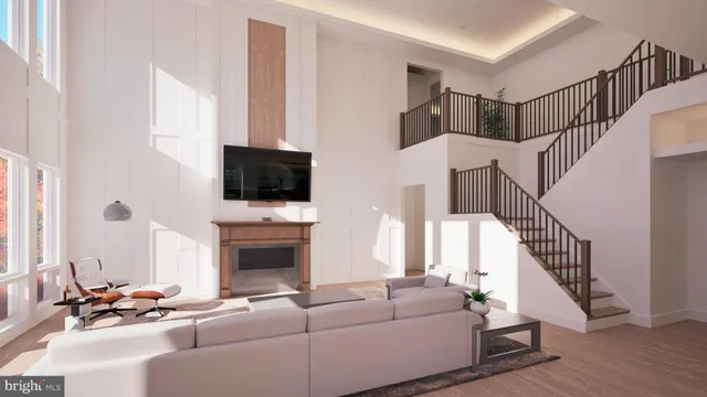 a living room with furniture fireplace and flat screen tv