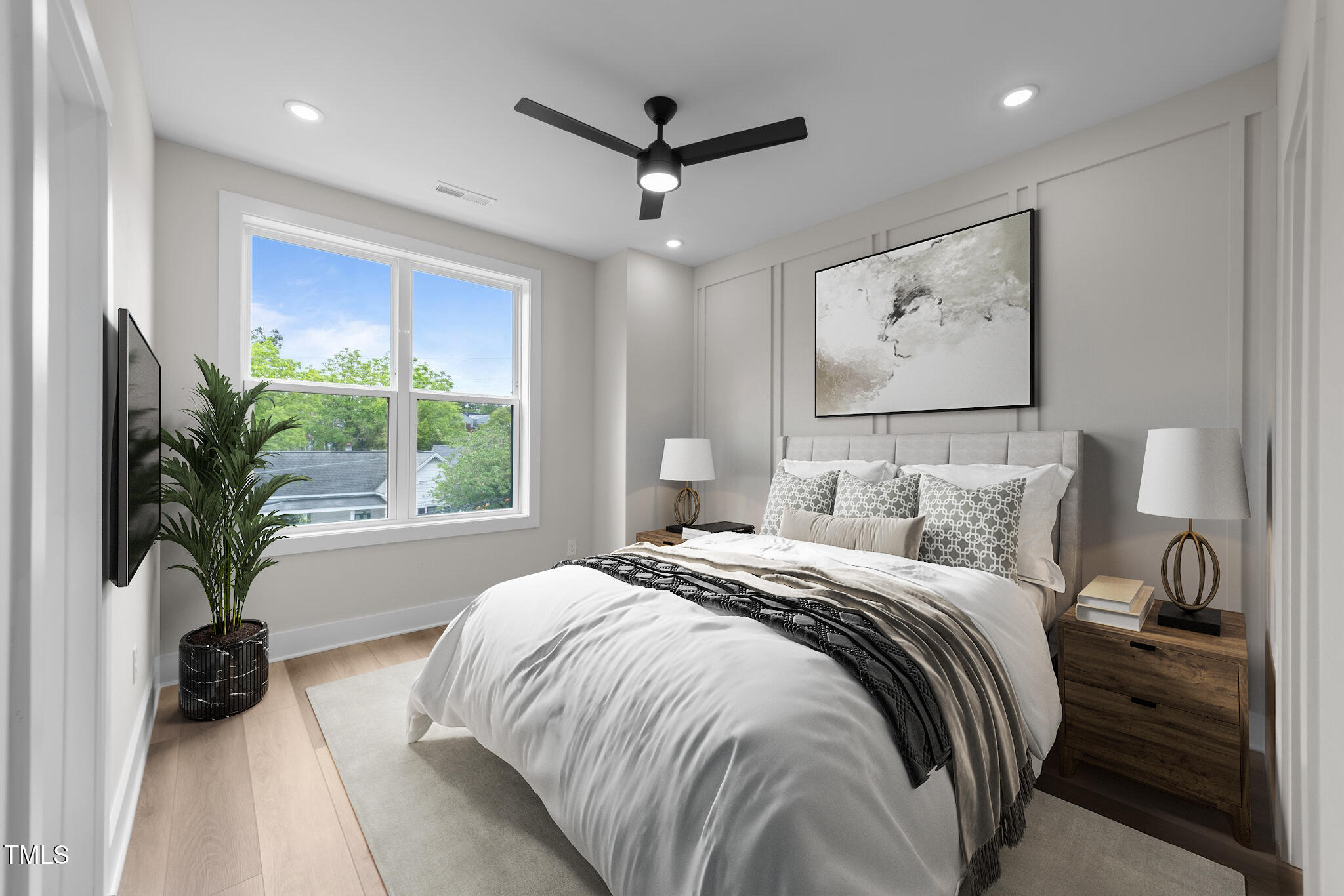 710 West North Street, Unit 101 Raleigh, NC 27603 - Photo 15 of 28 a bedroom with a bed and a window