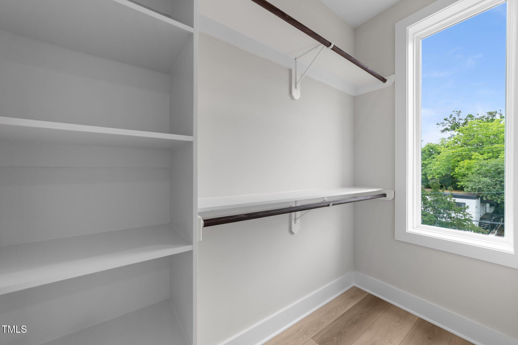 710 West North Street, Unit 101 Raleigh, NC 27603 - Photo 17 of 28 a view of an empty walk in closet
