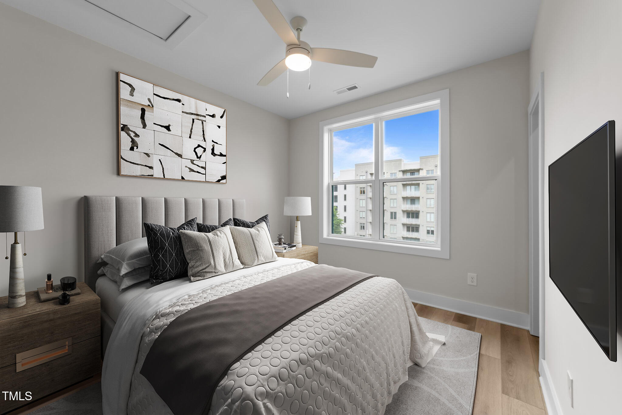 710 West North Street, Unit 101 Raleigh, NC 27603 - Photo 22 of 28 a bedroom with a bed and a window