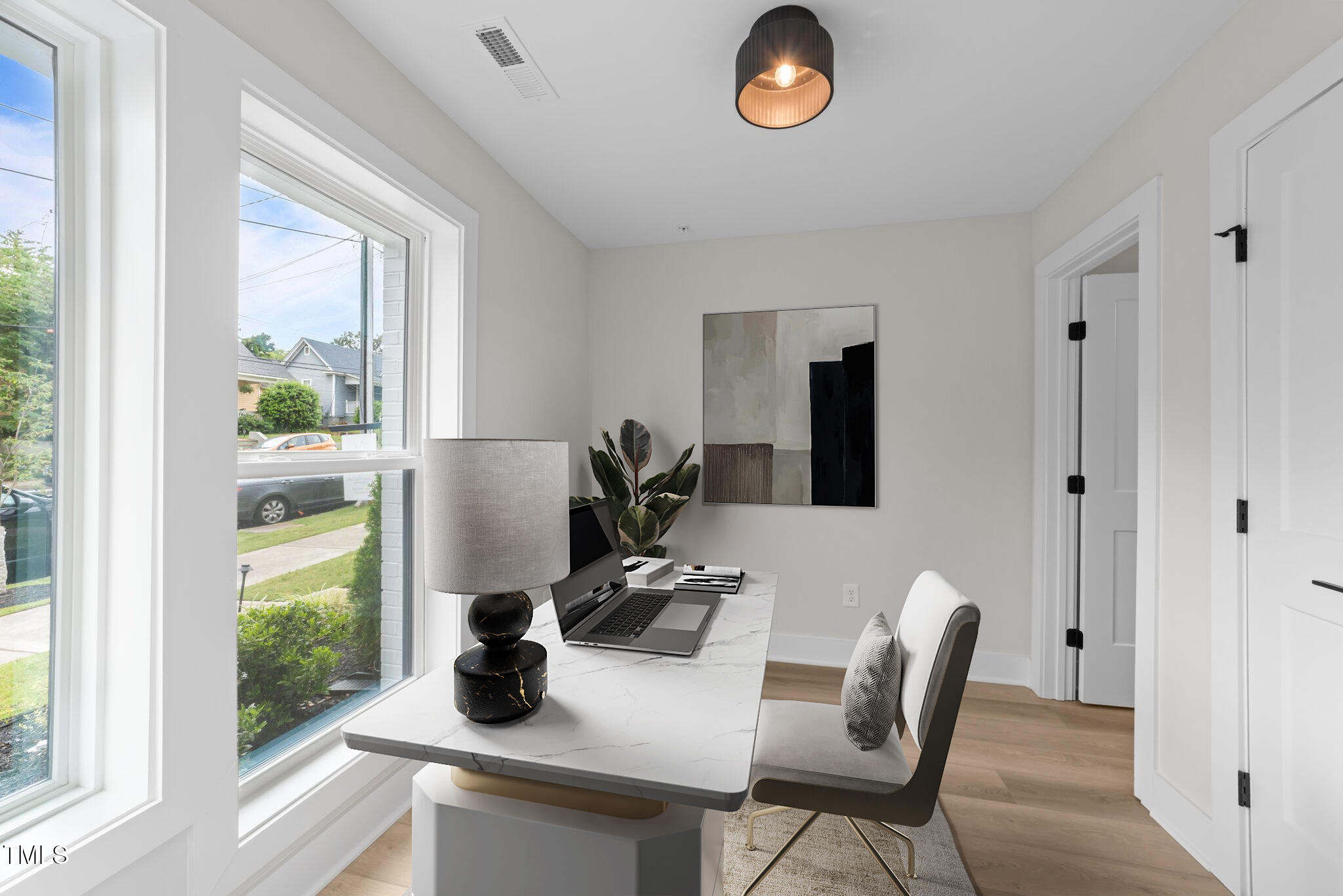 710 West North Street, Unit 101 Raleigh, NC 27603 - Photo 5 of 28 a dining room with furniture and window