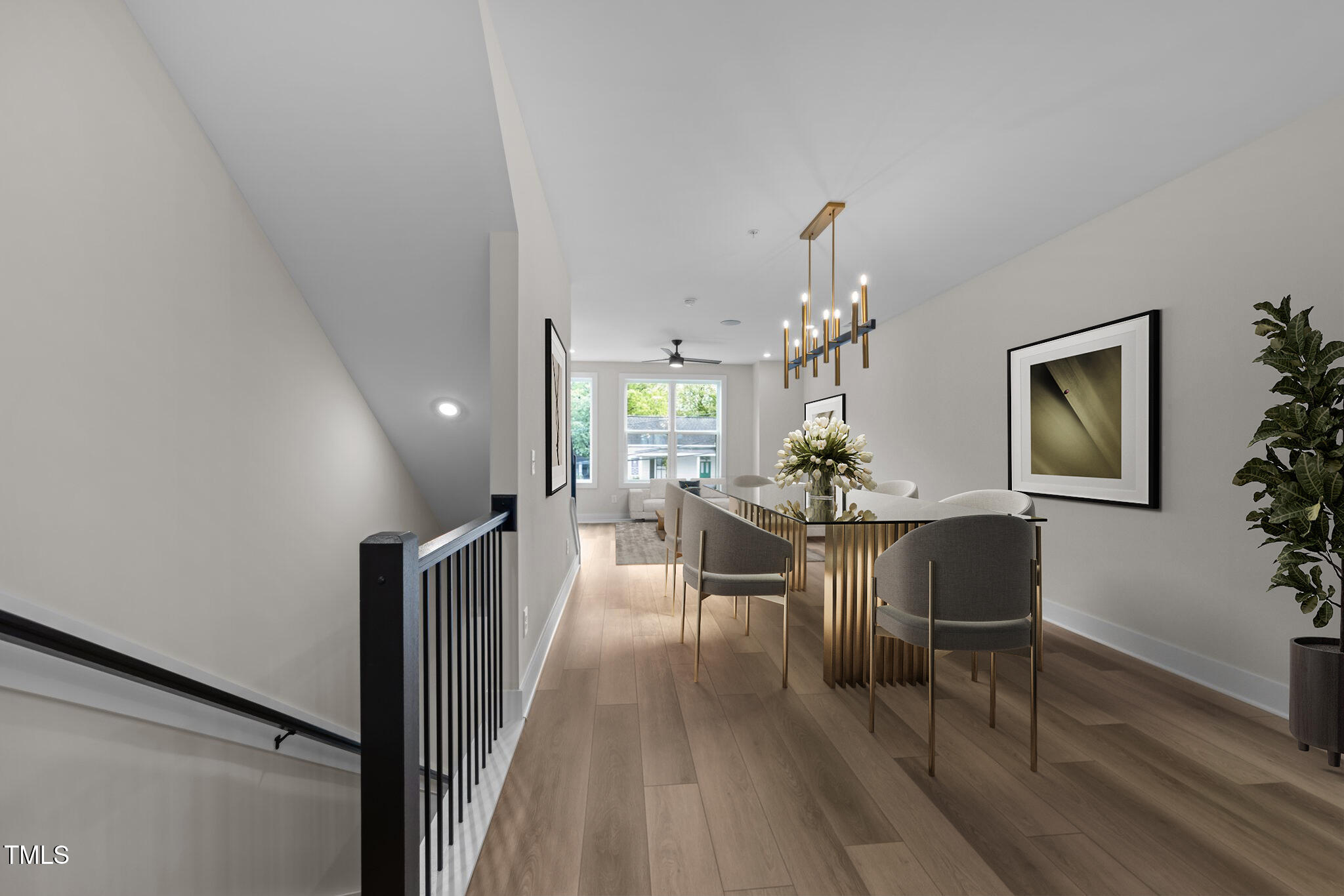 710 West North Street, Unit 101 Raleigh, NC 27603 - Photo 5 of 28 a view of a dining room with furniture and wooden floor