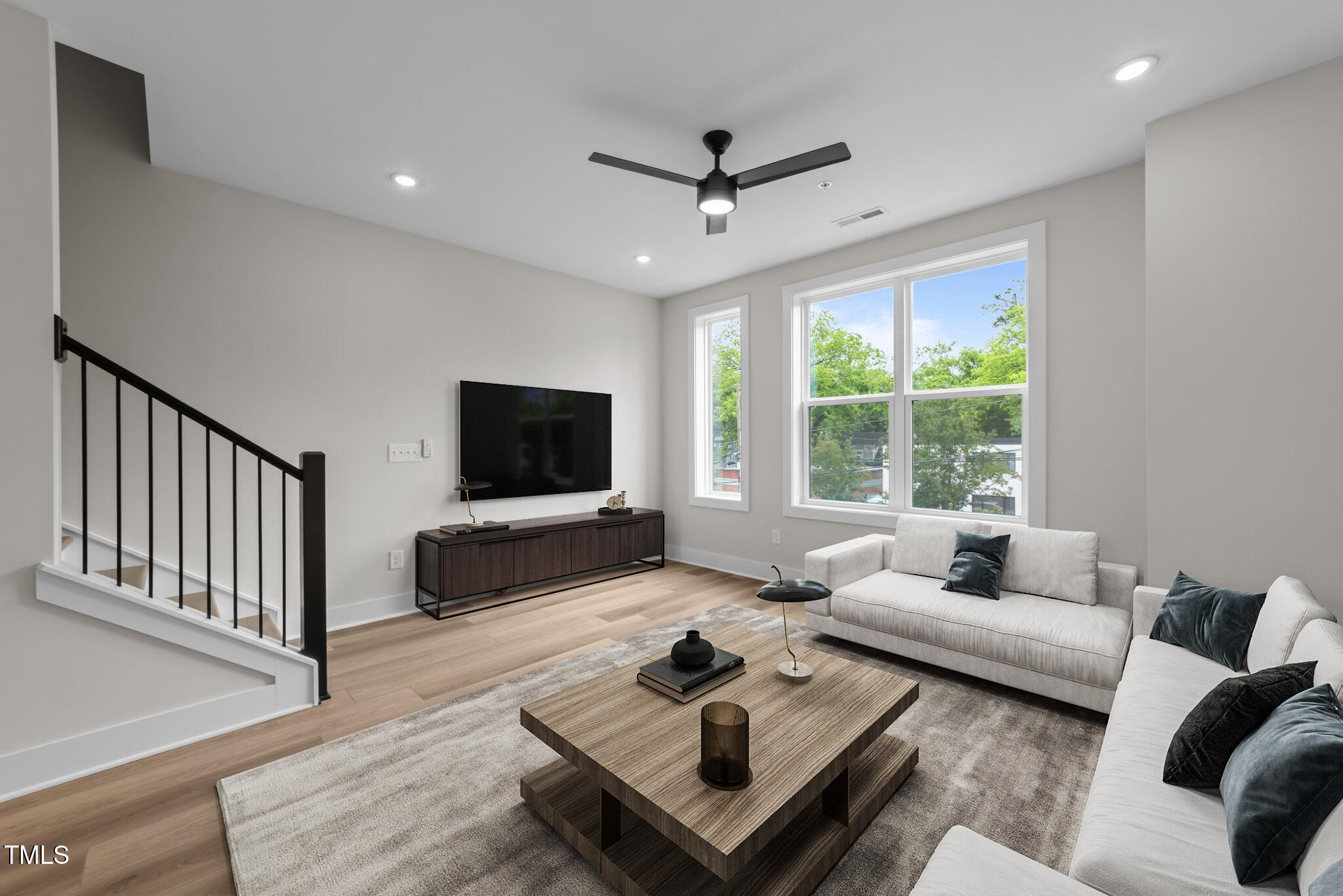 710 West North Street, Unit 101 Raleigh, NC 27603 - Photo 9 of 28 a living room with furniture and a flat screen tv