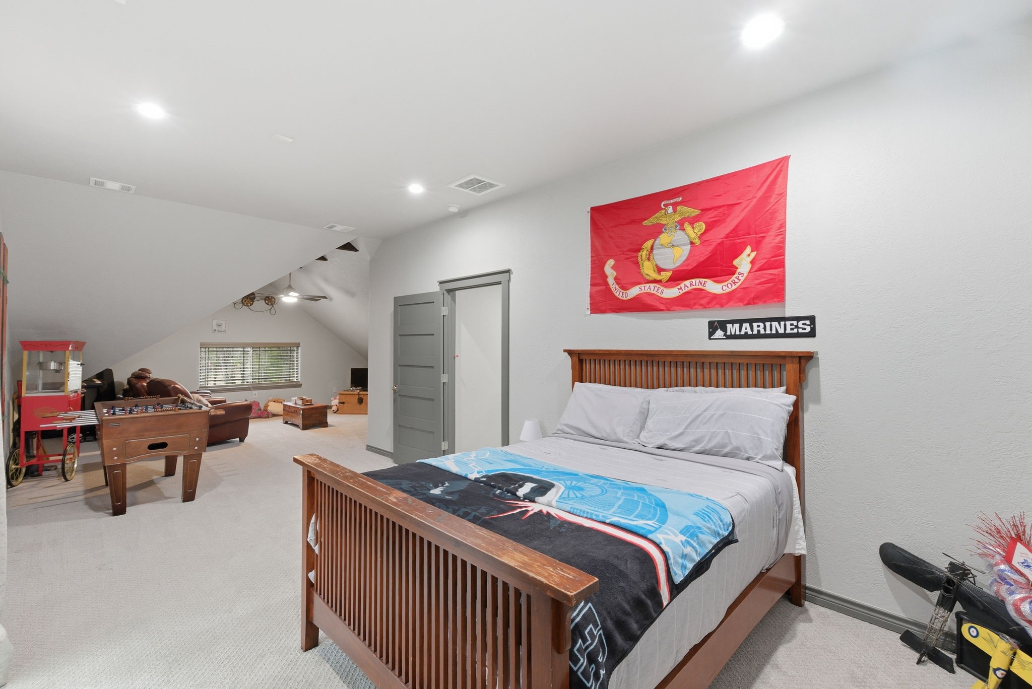 1480 Traylor Road Conroe, TX 77304 - Photo 17 of 25 a bedroom with furniture and a chandelier