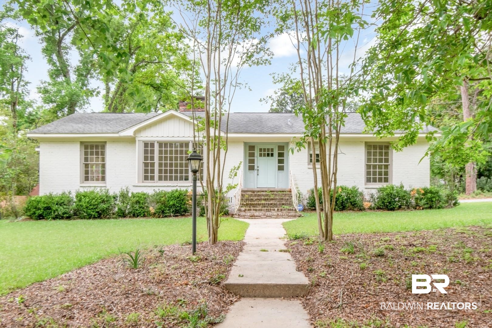 4 Turnout Lane Mobile, AL 36608 - Photo 38 of 53 Ranch-style home featuring brick siding, a front lawn, a shingled roof, and covered porch