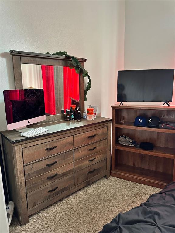 242 Durango Loop Street Davenport, FL 33897 - Photo 13 of 30 a living room with furniture and a window