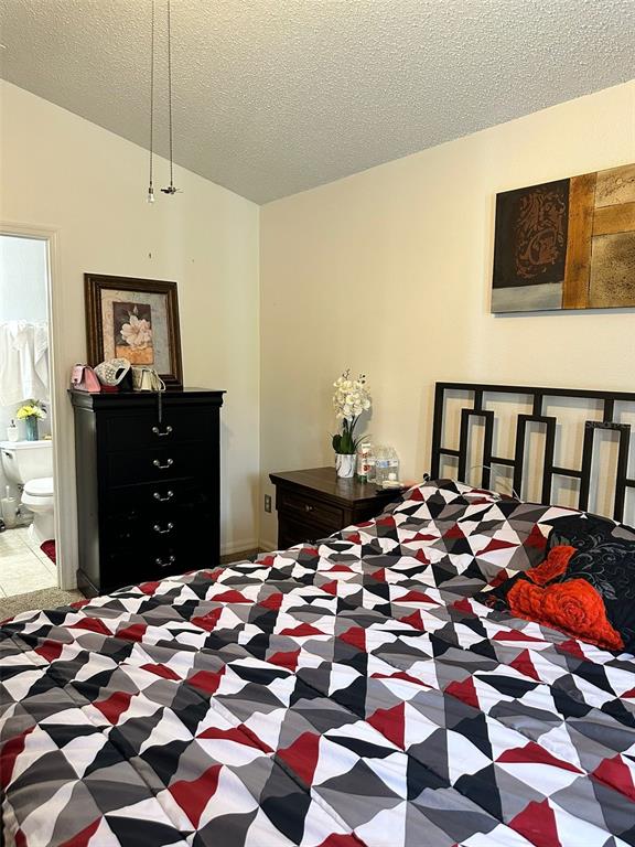 242 Durango Loop Street Davenport, FL 33897 - Photo 21 of 30 a bedroom with a bed and a dresser