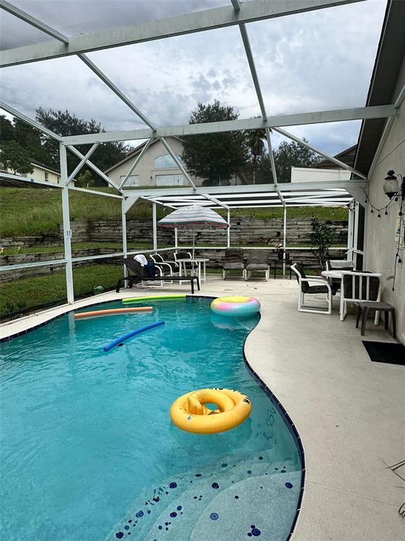 242 Durango Loop Street Davenport, FL 33897 - Photo 29 of 30 a room with furniture and wooden floor