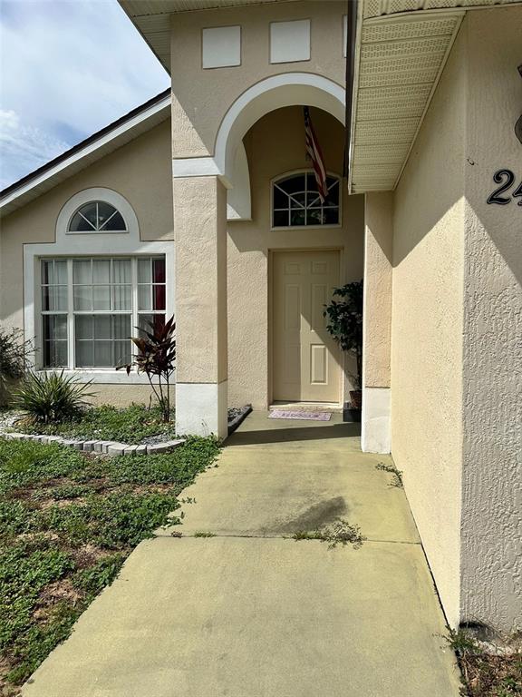 242 Durango Loop Street Davenport, FL 33897 - Photo 3 of 30 a front view of a house with a yard