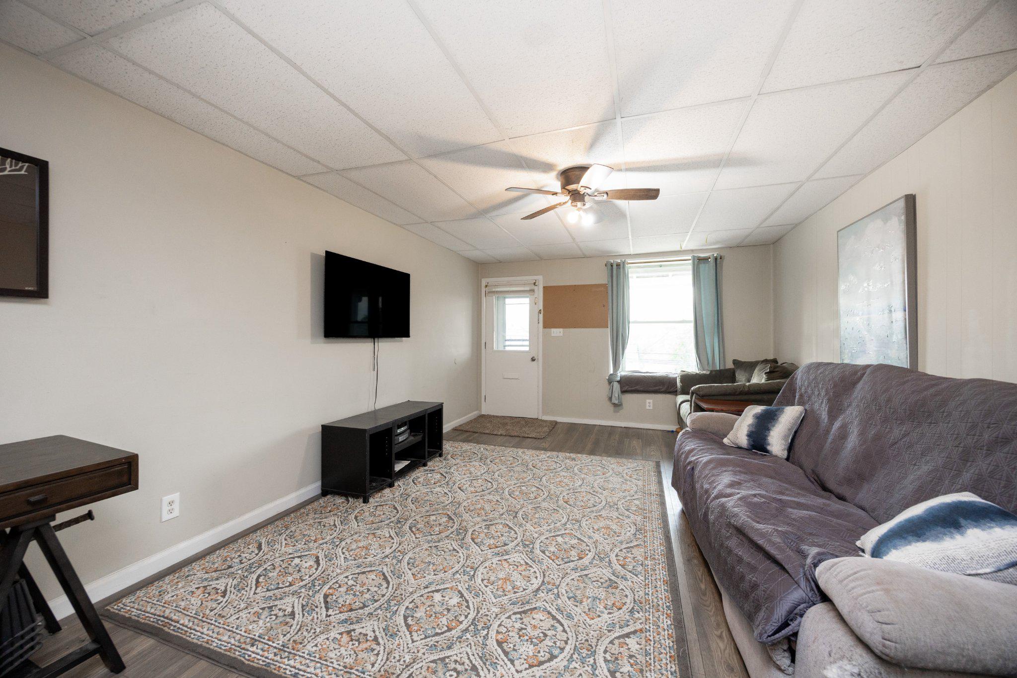 314 New Street Spring City, PA 19475 - Photo 2 of 16 a living room with furniture and a flat screen tv