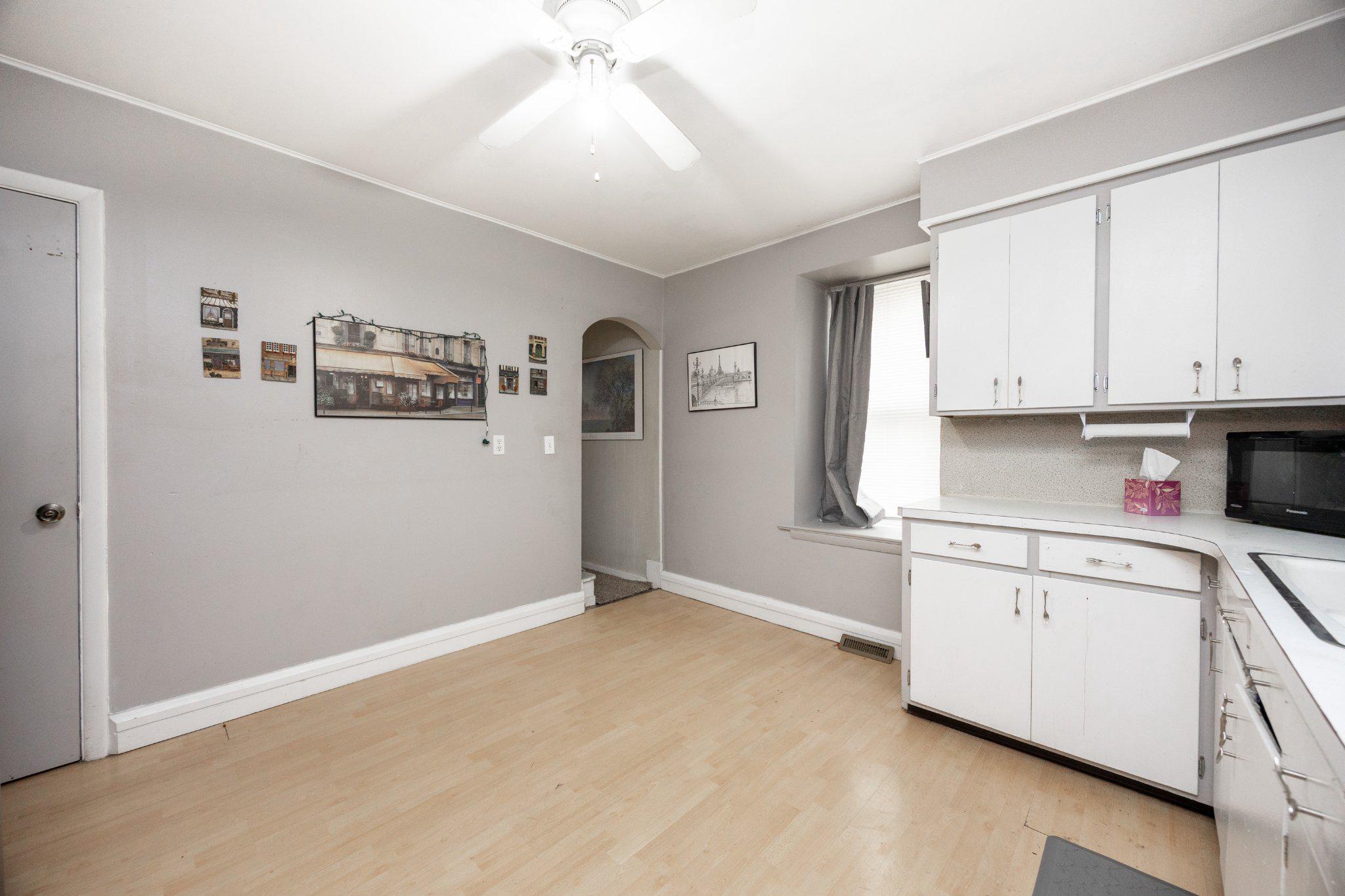 314 New Street Spring City, PA 19475 - Photo 5 of 16 a kitchen with granite countertop white cabinets and white appliances